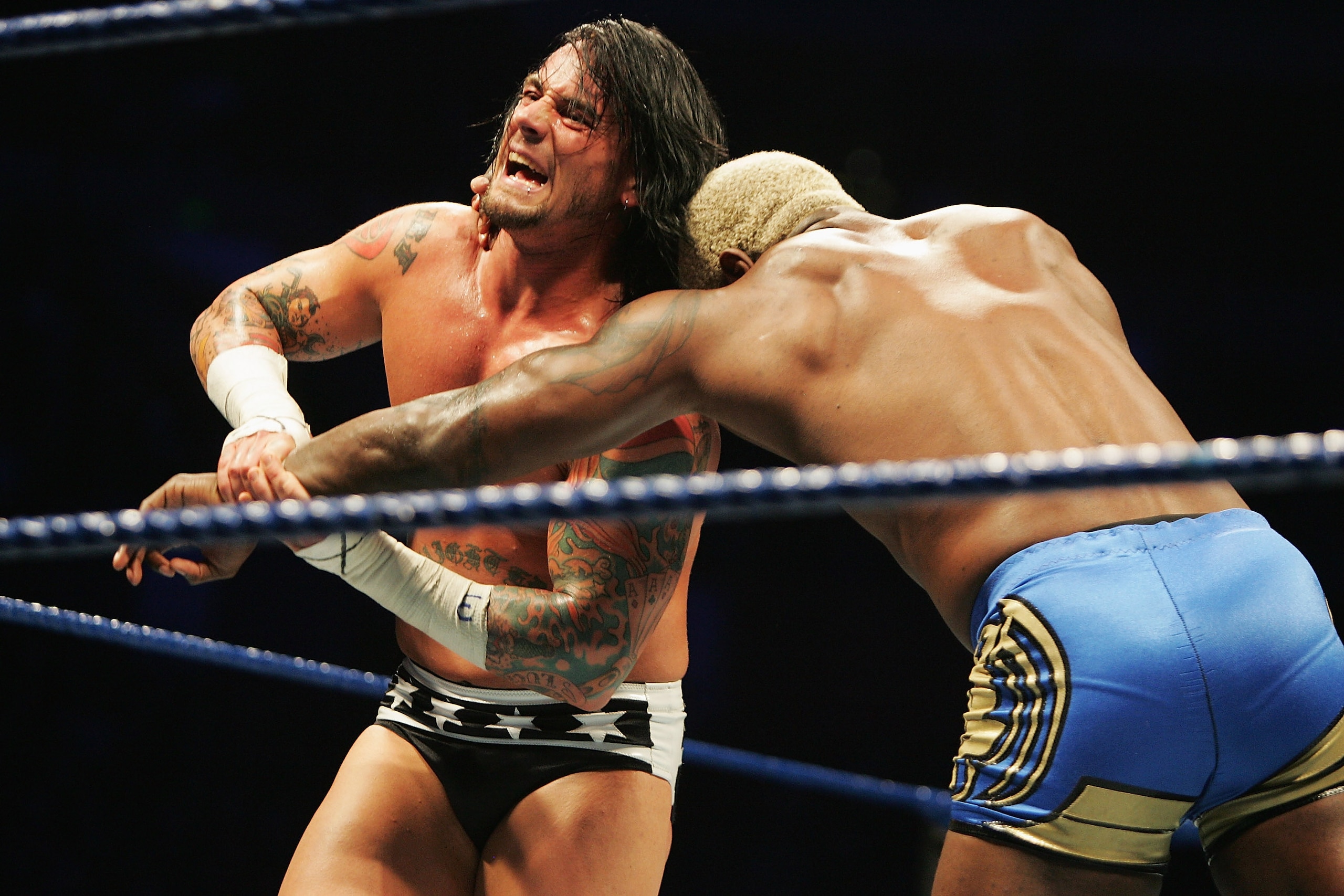 SYDNEY, AUSTRALIA - JUNE 15:  CM Punk wrestles Shelton Benjamin during WWE Smackdown at Acer Arena on June 15, 2008 in Sydney, Australia.  (Photo by Gaye Gerard/Getty Images)