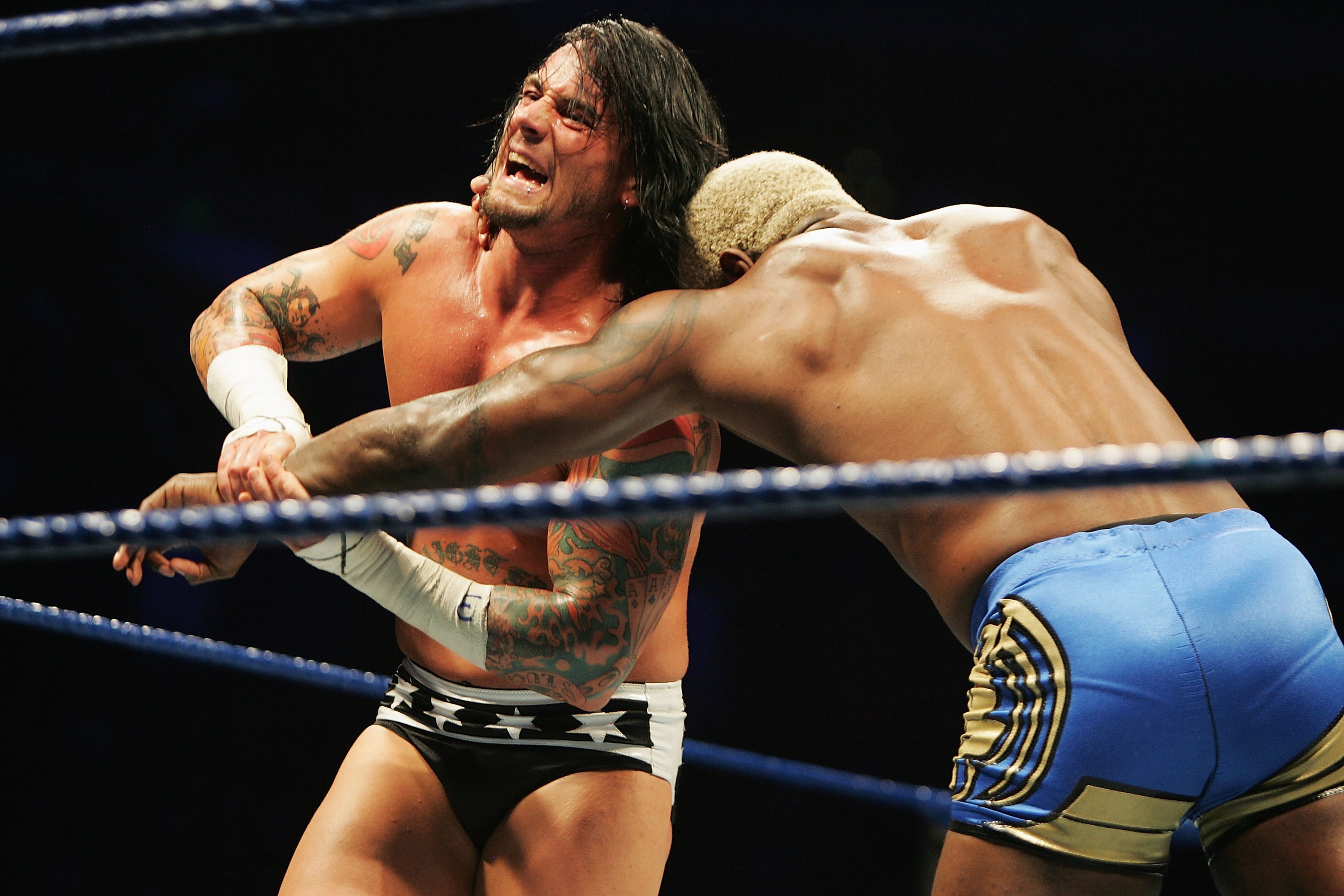 SYDNEY, AUSTRALIA - JUNE 15: CM Punk wrestles Shelton Benjamin during WWE Smackdown at Acer Arena on June 15, 2008 in Sydney, Australia. (Photo by Gaye Gerard/Getty Images) SYDNEY, AUSTRALIA - JUNE 15: CM Punk wrestles Shelton Benjamin during WWE Smackdown at Acer Arena on June 15, 2008 in Sydney, Australia. (Photo by Gaye Gerard/Getty Images)