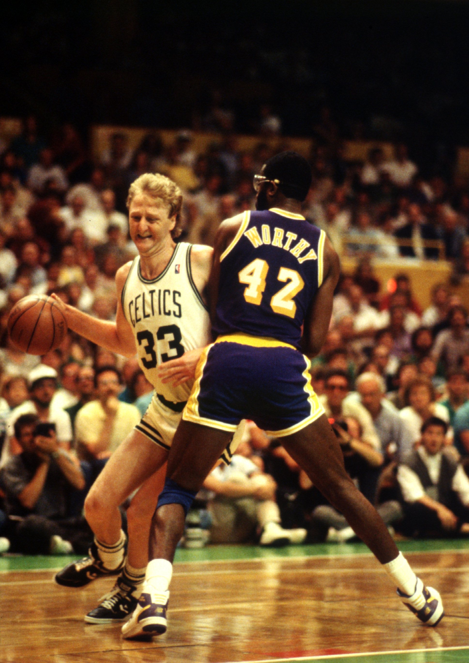 JUN 1987:  BOSTON FORWARD LARRY BIRD TRIES TO DRIVE AROUND LOS ANGELES FORWARD JAMES WORTHY DURING THE CELTICS GAME VERSUS THE LAKERS IN THE NBA FINALS AT THE BOSTON GARDEN IN  BOSTON, MASSACHUSETTS. Mandatory Credit: Jonathan Daniel/ALLSPORT