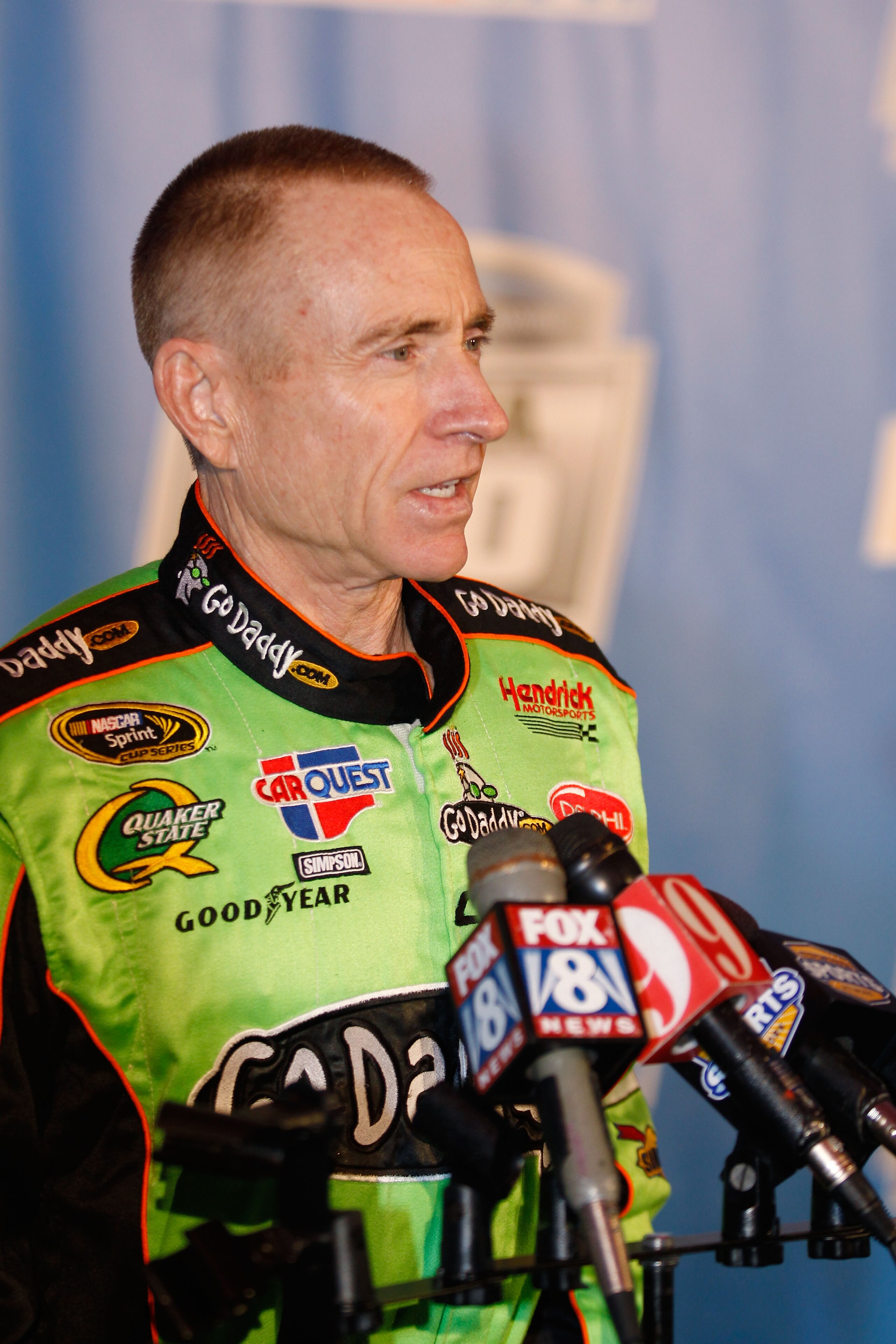 DAYTONA BEACH, FL - FEBRUARY 10:  Mark Martin, driver of the #5 GoDaddy.com Chevrolet, speaks to the media during the 2011 NASCAR Media Day at Daytona International Speedway on February 10, 2011 in Daytona Beach, Florida.  (Photo by Todd Warshaw/Getty Ima