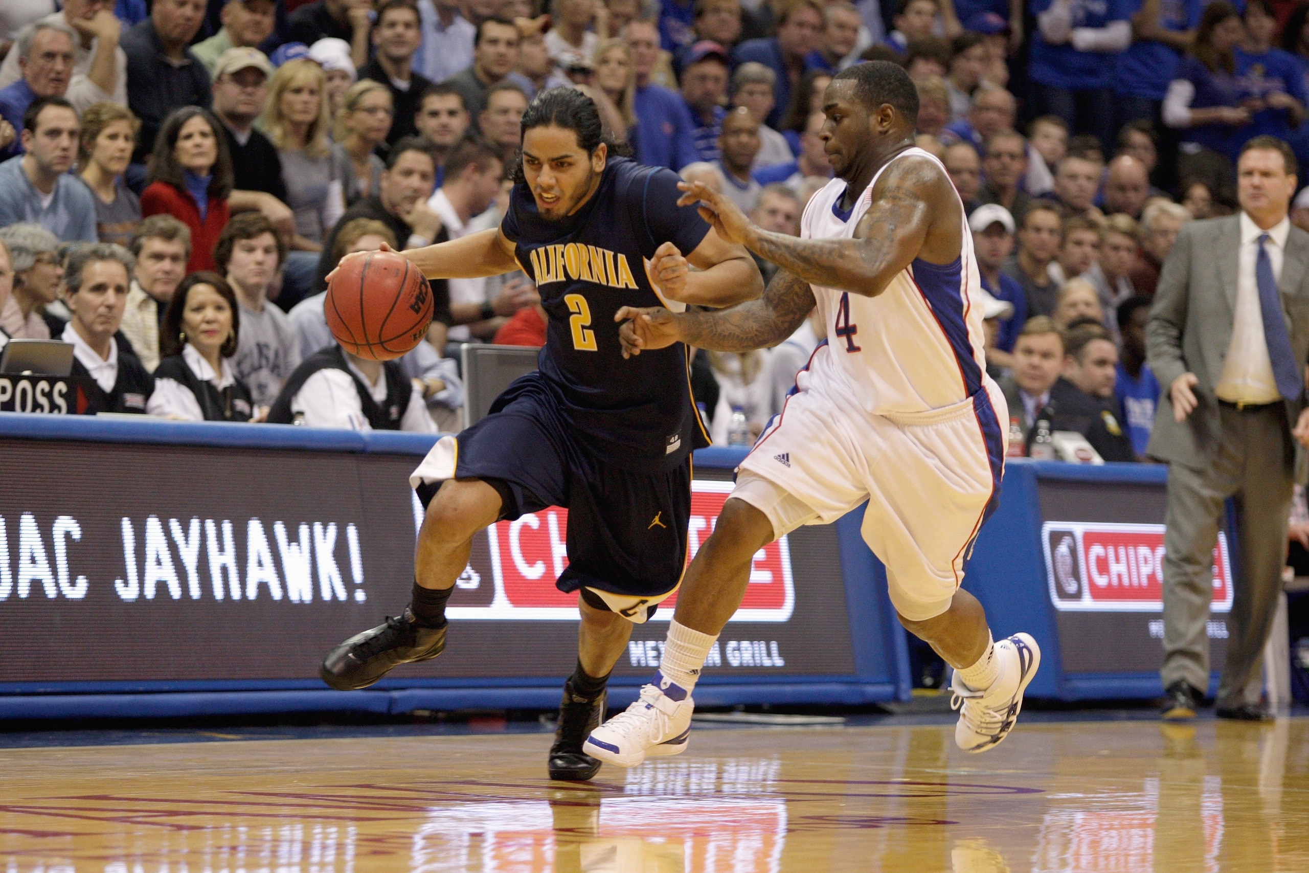 LAWRENCE, KS - DECEMBER 22: Jorge Gutierrez #2 of the California Golden Bears drives the ball downcourt against Sherron Collins #4 of the Kansas Jayhawks on December 22, 2009 at Allen Fieldhouse in Lawrence, Kansas. (Photo by Jamie Squire/Getty Images) LAWRENCE, KS - DECEMBER 22: Jorge Gutierrez #2 of the California Golden Bears drives the ball downcourt against Sherron Collins #4 of the Kansas Jayhawks on December 22, 2009 at Allen Fieldhouse in Lawrence, Kansas. (Photo by Jamie Squire/Getty Images)