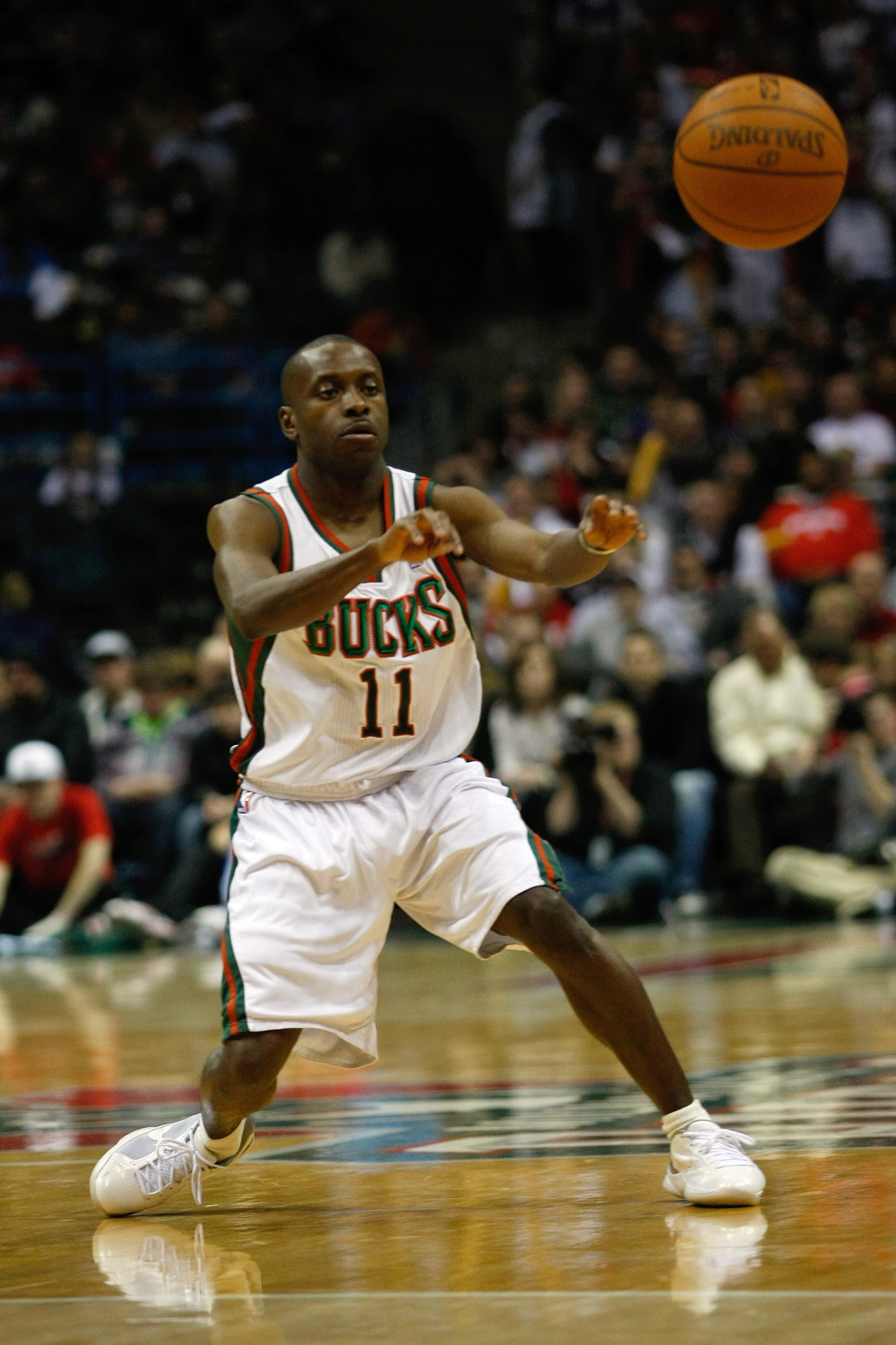 MILWAUKEE, WI - JANUARY 07: Earl Boykins #11 of the Milwaukee Bucks passes against the Miami Heat at the Bradley Center on January 7, 2011 in Milwaukee, Wisconsin. NOTE TO USER: User expressly acknowledges and agrees that, by downloading and or using this