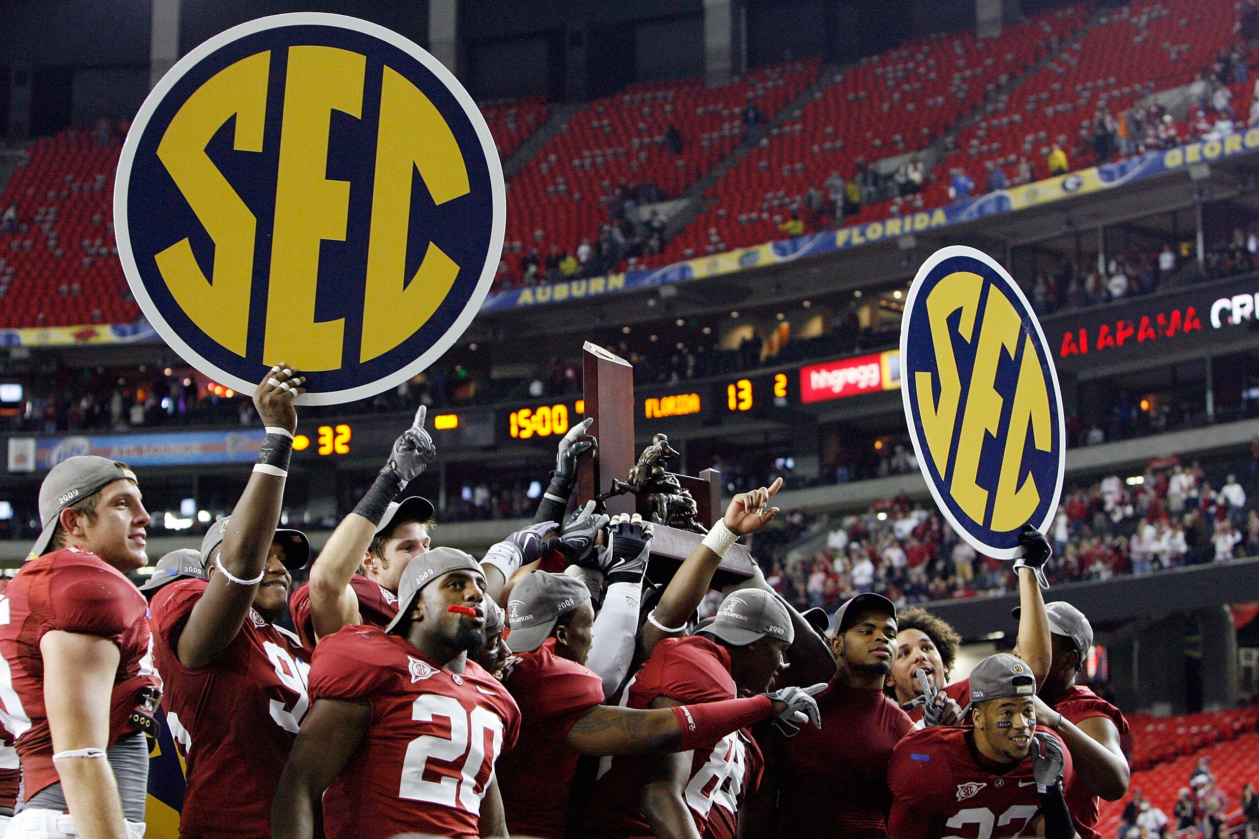 ATLANTA - DECEMBER 05:  Members of the Alabama Crimson Tide celebrate after defeating the Florida Gators 31-13 during the SEC Championship at the Georgia Dome on December 5, 2009 in Atlanta, Georgia.  (Photo by Chris Graythen/Getty Images)