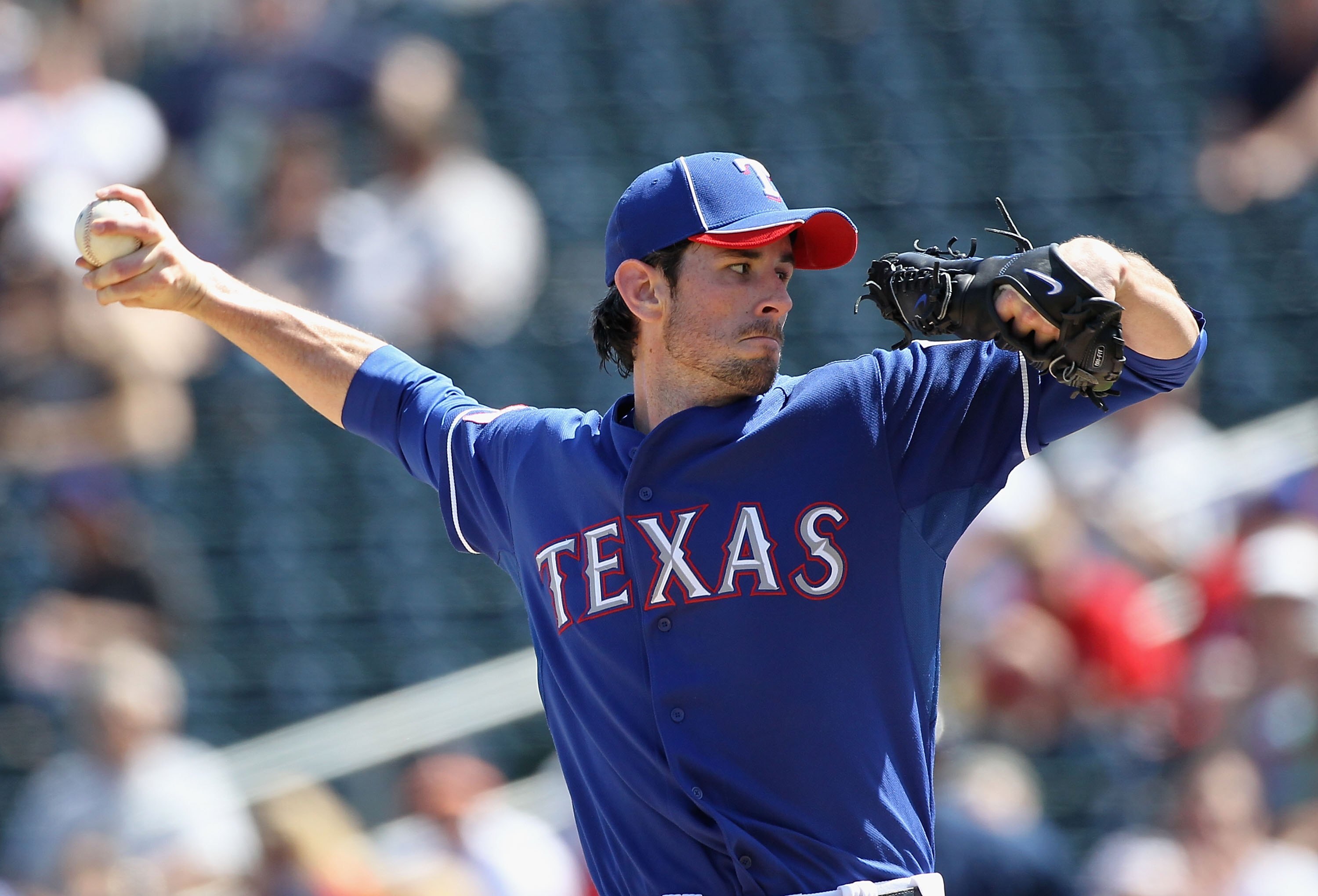 SURPRISE, AZ - MARCH 19:  Starting pitcher Brandon McCarthy #20 of the Texas Rangers pitches against the Cleveland Indians during the MLB spring training game at Surprise Stadium on March 19, 2010 in Surprise, Arizona. The Indians defeated the Rangers 12-