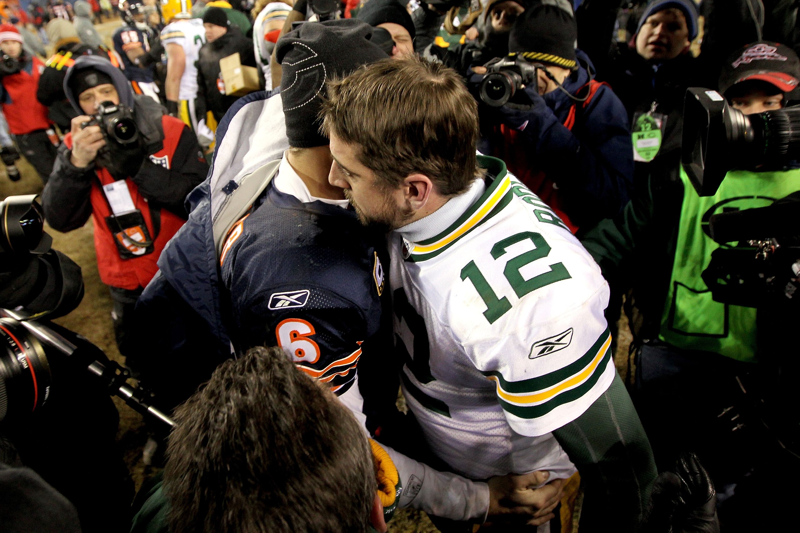 CHICAGO, IL - JANUARY 23: Quarterback Aaron Rodgers #12 of the Green Bay Packers hugs Jay Cutler #6 of the Chicago Bears after the Packers 21-14 victory against the Bears in the NFC Championship Game at Soldier Field on January 23, 2011 in Chicago, Illin CHICAGO, IL - JANUARY 23: Quarterback Aaron Rodgers #12 of the Green Bay Packers hugs Jay Cutler #6 of the Chicago Bears after the Packers 21-14 victory against the Bears in the NFC Championship Game at Soldier Field on January 23, 2011 in Chicago, Illin