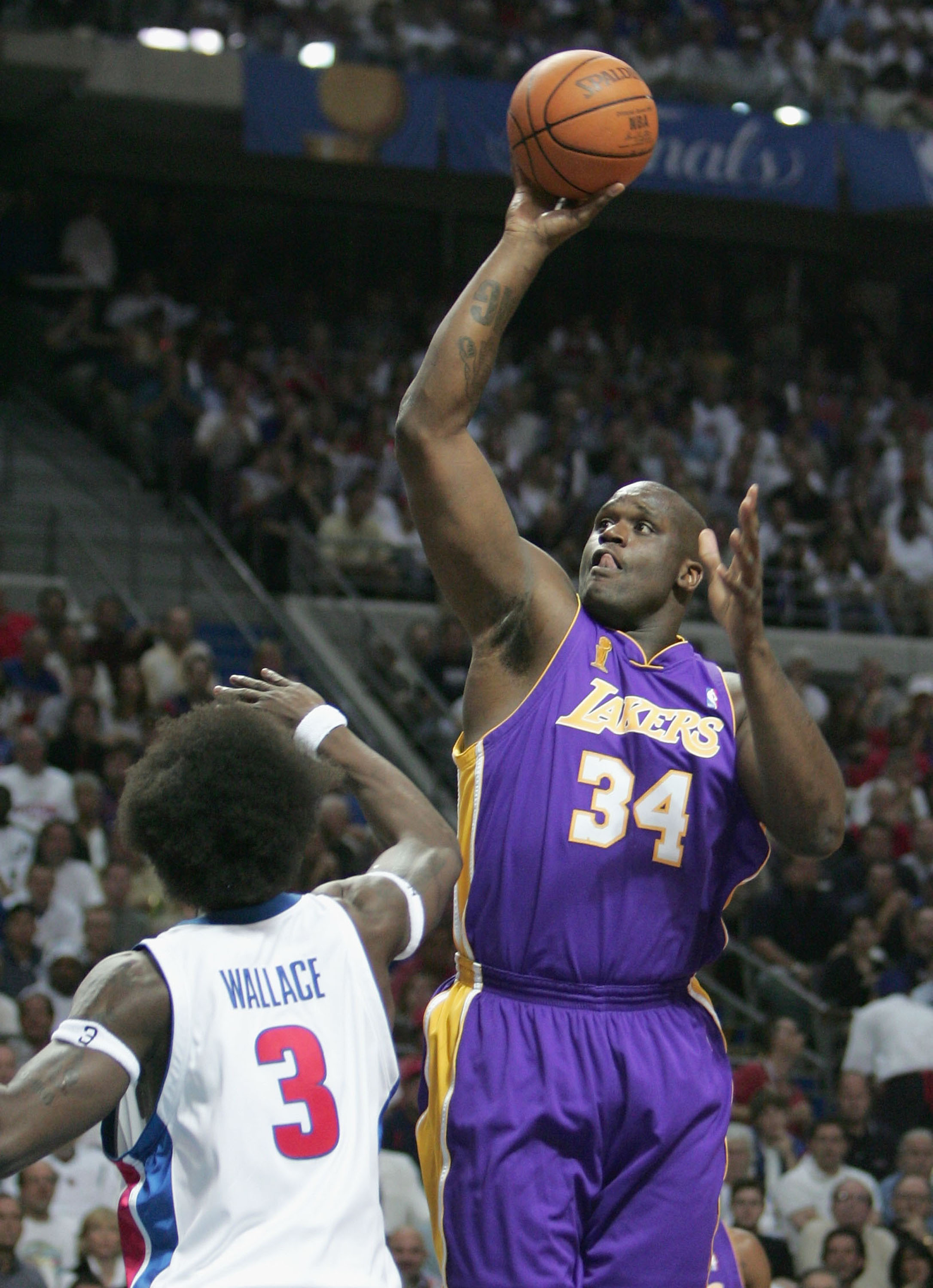 AUBURN HILLS, MI - JUNE 15:  Shaquille O'Neal #34 of the Los Angeles Lakers shoots over Ben Wallace #3 of the Detroit Pistons in the first quarter of game five of the 2004 NBA Finals on June 15, 2004 at The Palace of Auburn Hills in Auburn Hills, Michigan