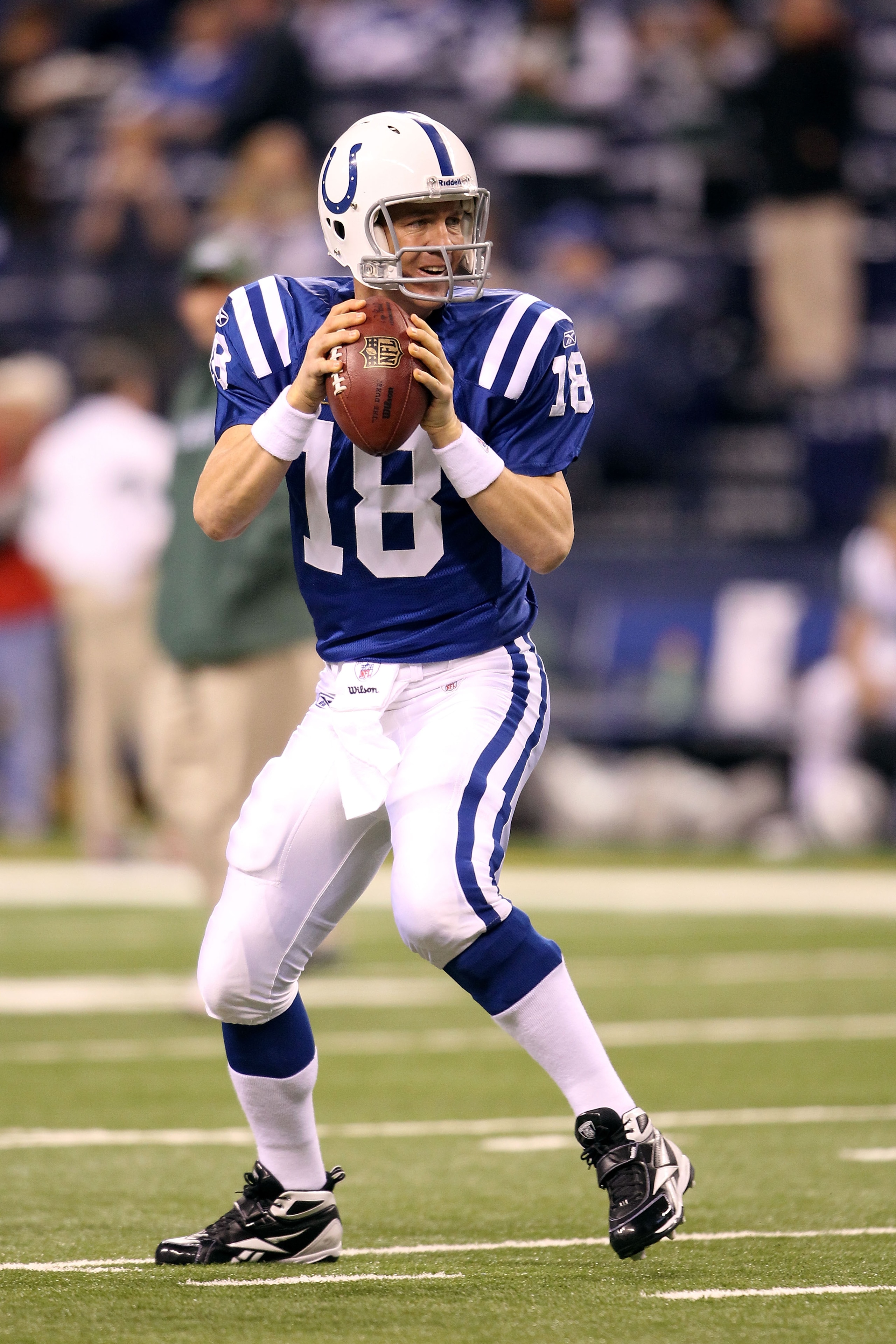 INDIANAPOLIS, IN - JANUARY 08:  Peyton Manning #18 of the Indianapolis Colts warms up against the New York Jets during their 2011 AFC wild card playoff game at Lucas Oil Stadium on January 8, 2011 in Indianapolis, Indiana.  (Photo by Andy Lyons/Getty Imag