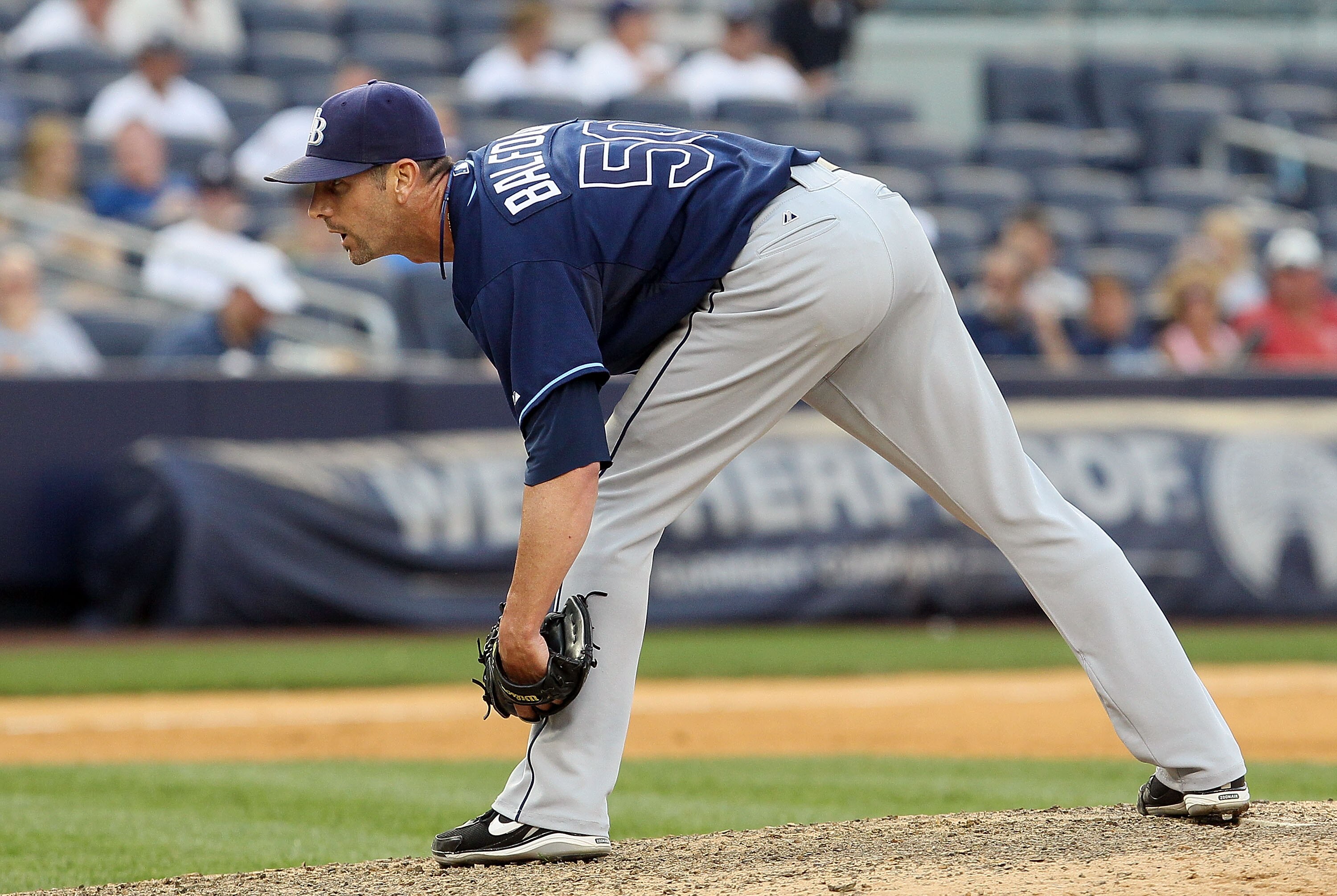 NEW YORK - JULY 17:  Grant Balfour #50 of the Tampa Bay Rays delivers a pitch against the New York Yankees on July 17, 2010 at Yankee Stadium in the Bronx borough of New York City. The Rays defeated the Yankees 10-5.  (Photo by Jim McIsaac/Getty Images)