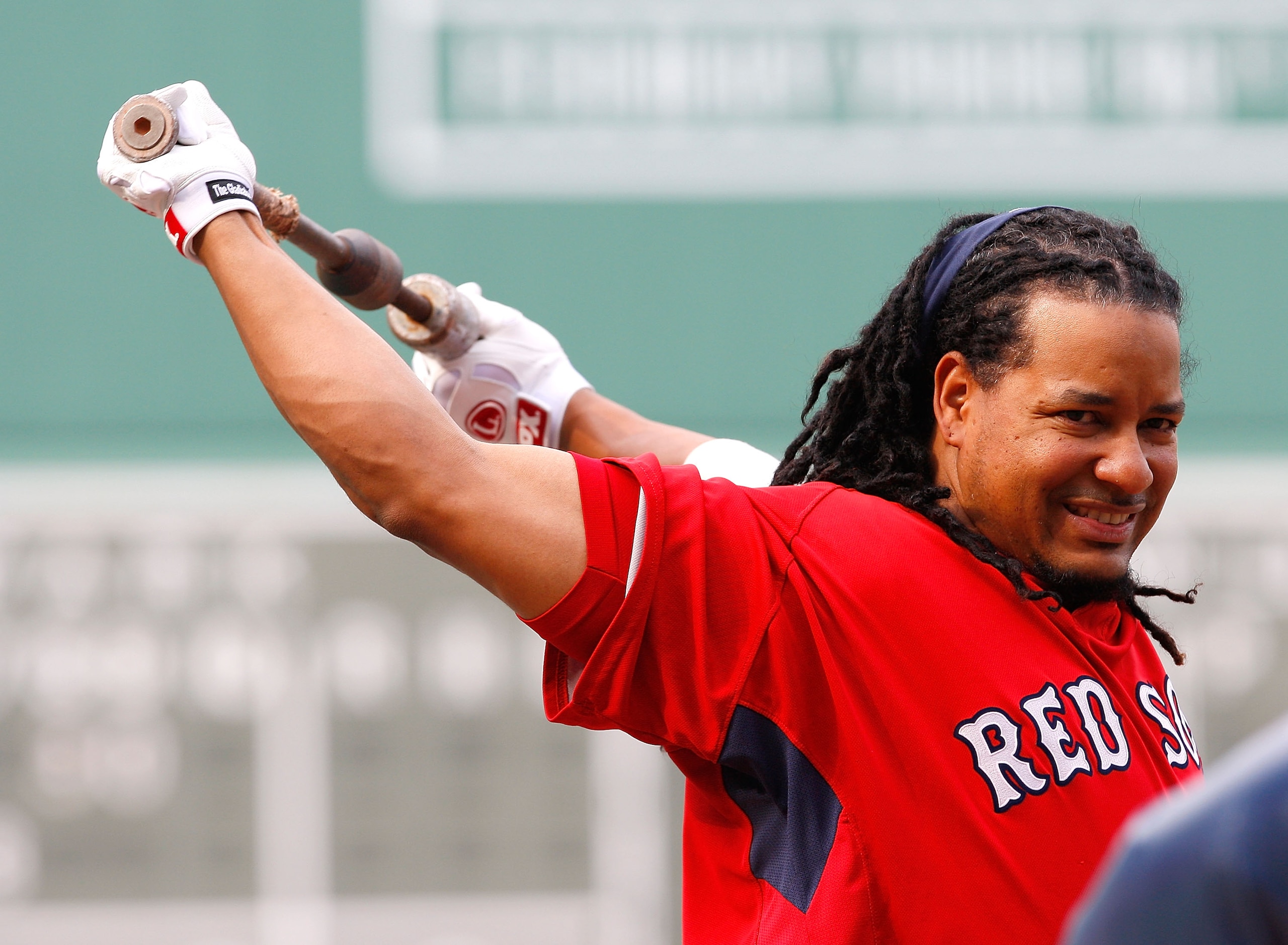 BOSTON - JULY 30: Manny Ramirez #24 of the the Boston Red Sox stretches before taking batting practice prior to a game against the Los Angeles Angels of Anaheim throws against the Boston Red Sox at Fenway Park on July 30, 2008 in Boston, Massachusetts.  (
