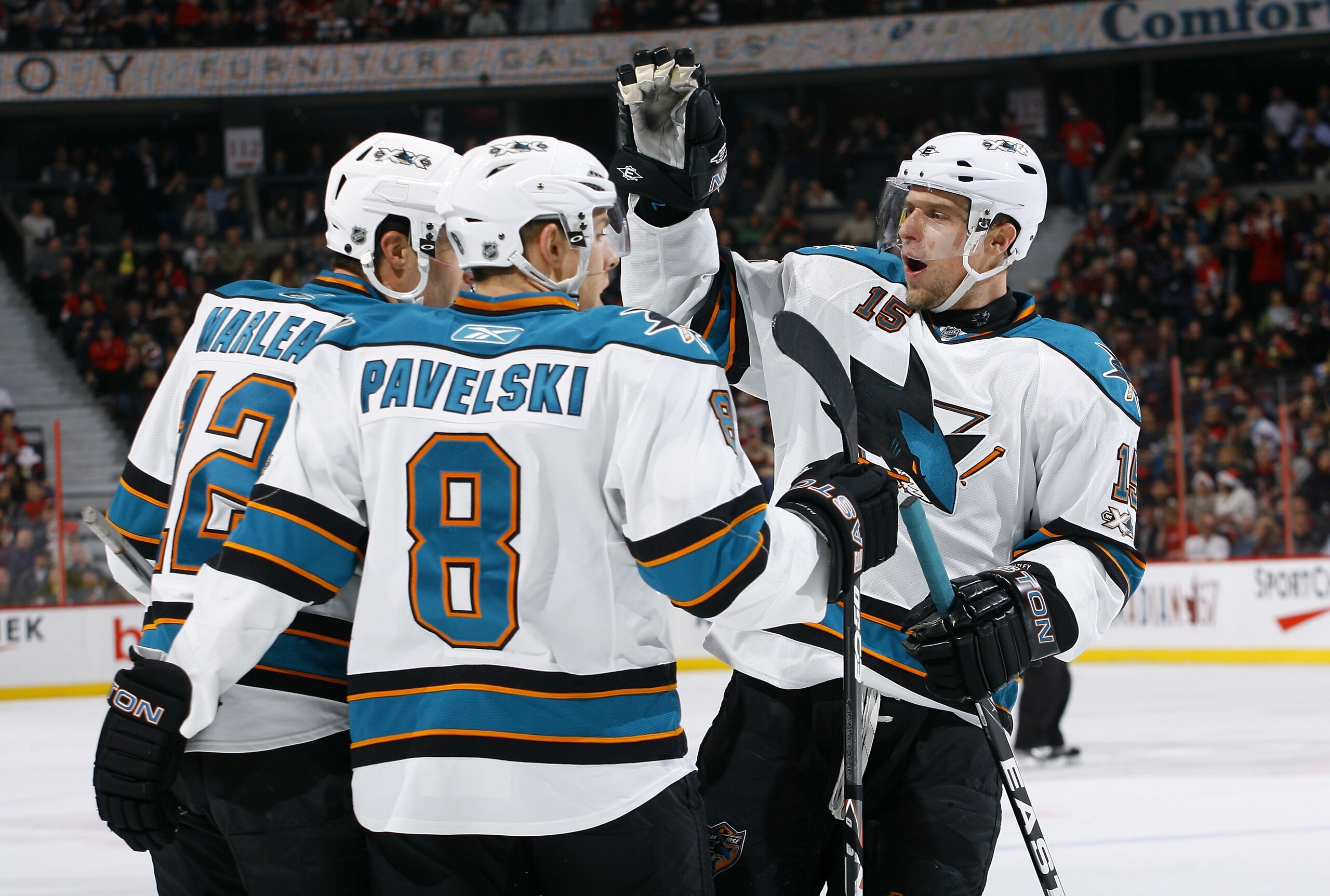 OTTAWA, ON - DECEMBER 02:  Patrick Marleau #12 of the San Jose Sharks celebrates his goal against the Ottawa Senators with teammates Joe Pavelski #8 and Dany Heatley #15 in a game at Scotiabank Place on December 2, 2010 in Ottawa, Ontario, Canada.  (Photo