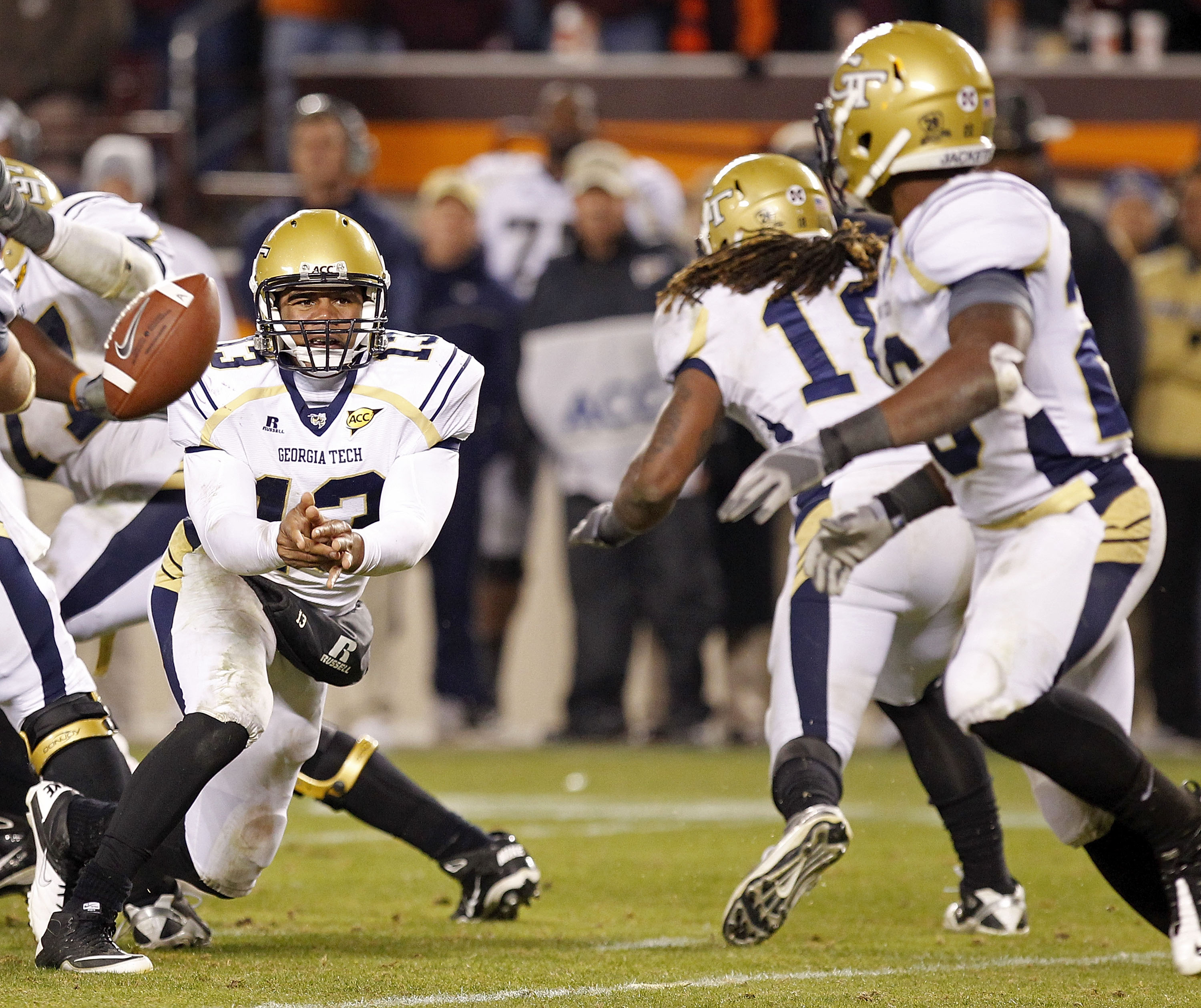 BLACKSBURG, VA - NOVEMBER 04: Quarterback Tevin Washington #13 of the Georgia Tech Yellow Jackets pitches the ball to running back Roddy Jones #20 of the Georgia Tech Yellow Jackets against the Virginia Tech Hokies at Lane Stadium on November 4, 2010 in B