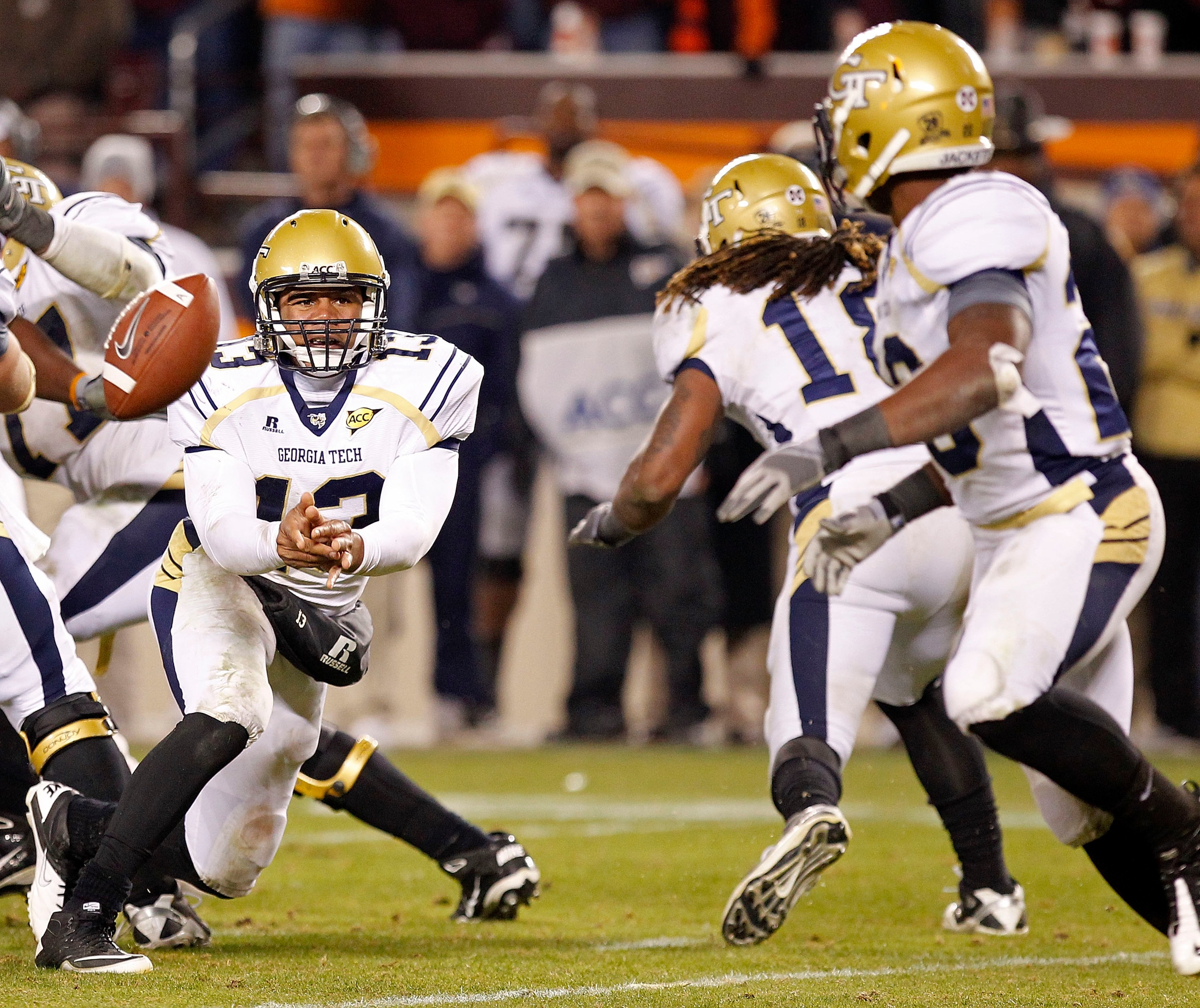BLACKSBURG, VA - NOVEMBER 04: Quarterback Tevin Washington #13 of the Georgia Tech Yellow Jackets pitches the ball to running back Roddy Jones #20 of the Georgia Tech Yellow Jackets against the Virginia Tech Hokies at Lane Stadium on November 4, 2010 in B