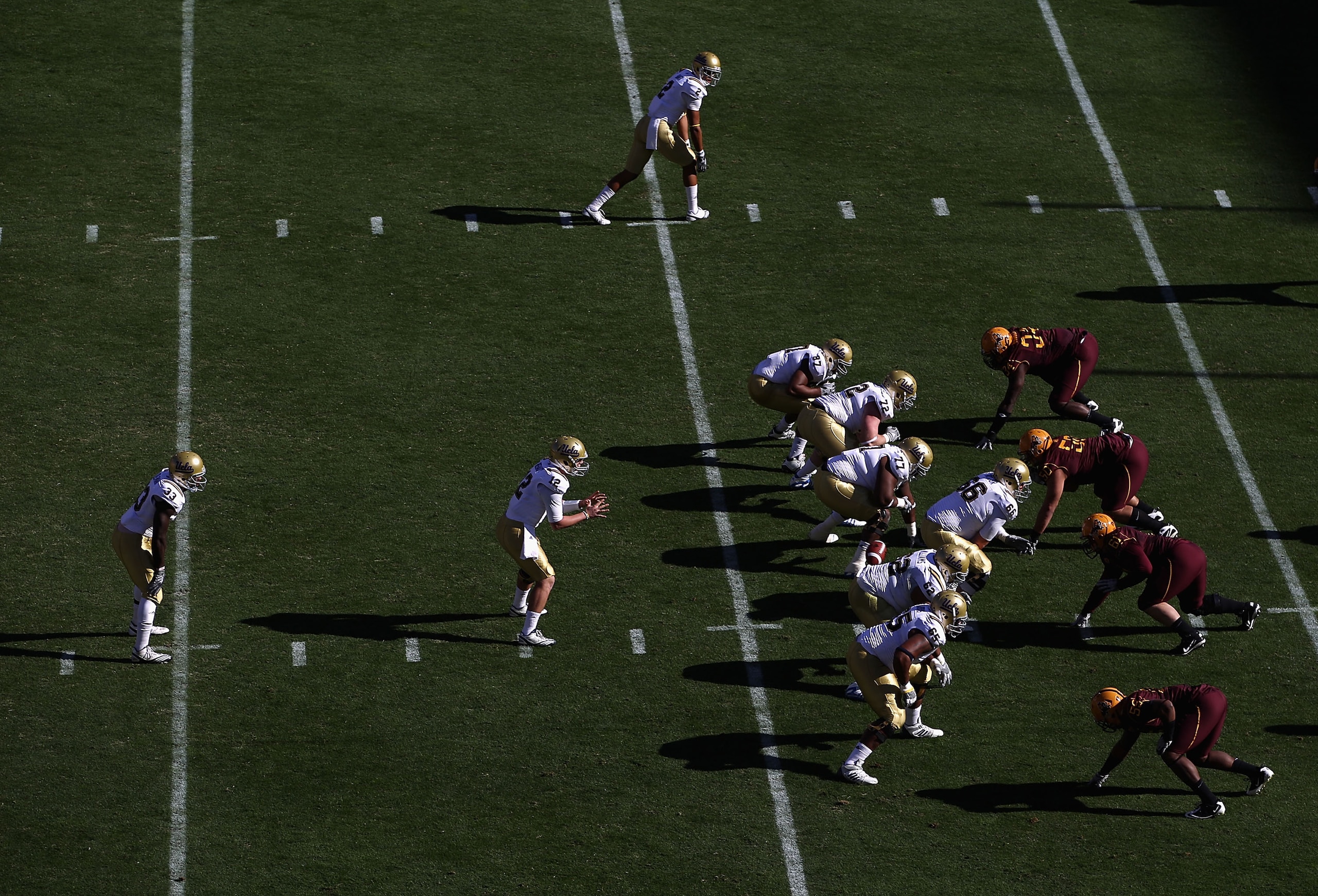 TEMPE, AZ - NOVEMBER 26:  Quarterback Richard Brehaut #12 of the UCLA Bruins hikes the football during the college football game against the Arizona State Sun Devils at Sun Devil Stadium on November 26, 2010 in Tempe, Arizona. The Sun Devils defeated the