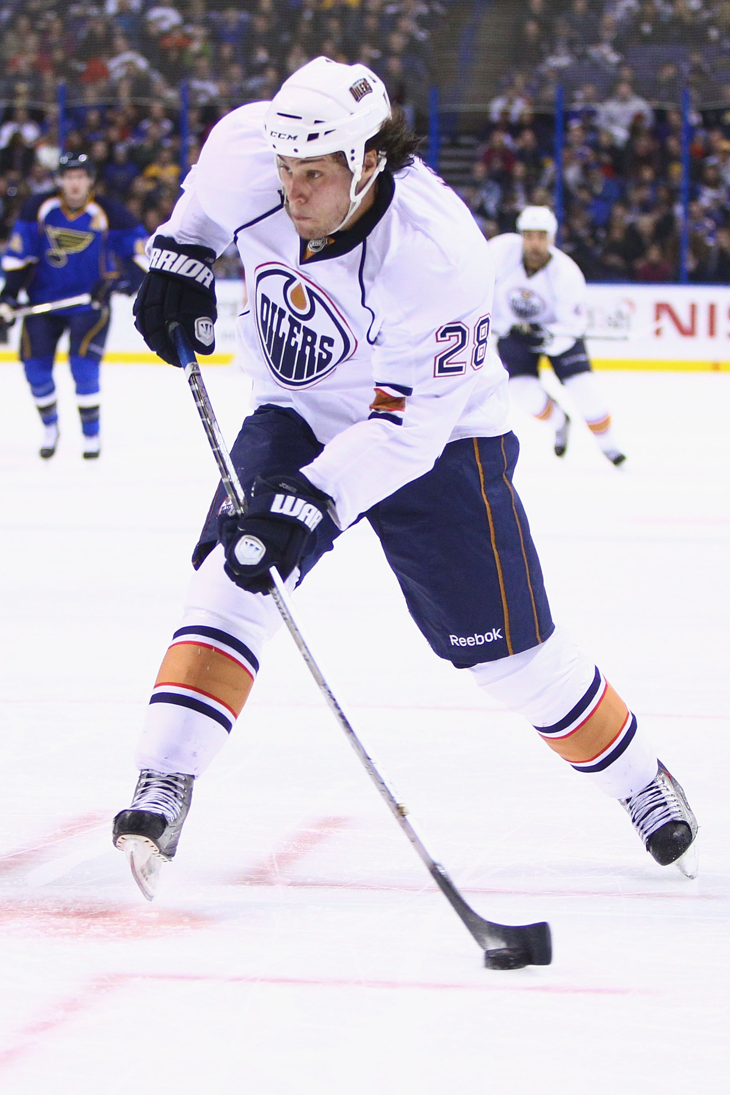 ST. LOUIS, MO - FEBRUARY 4: Ryan Jones #28 of the Edmonton Oilers shoots the puck against the St. Louis Blues at the Scottrade Center on February 4, 2011 in St. Louis, Missouri.  (Photo by Dilip Vishwanat/Getty Images)