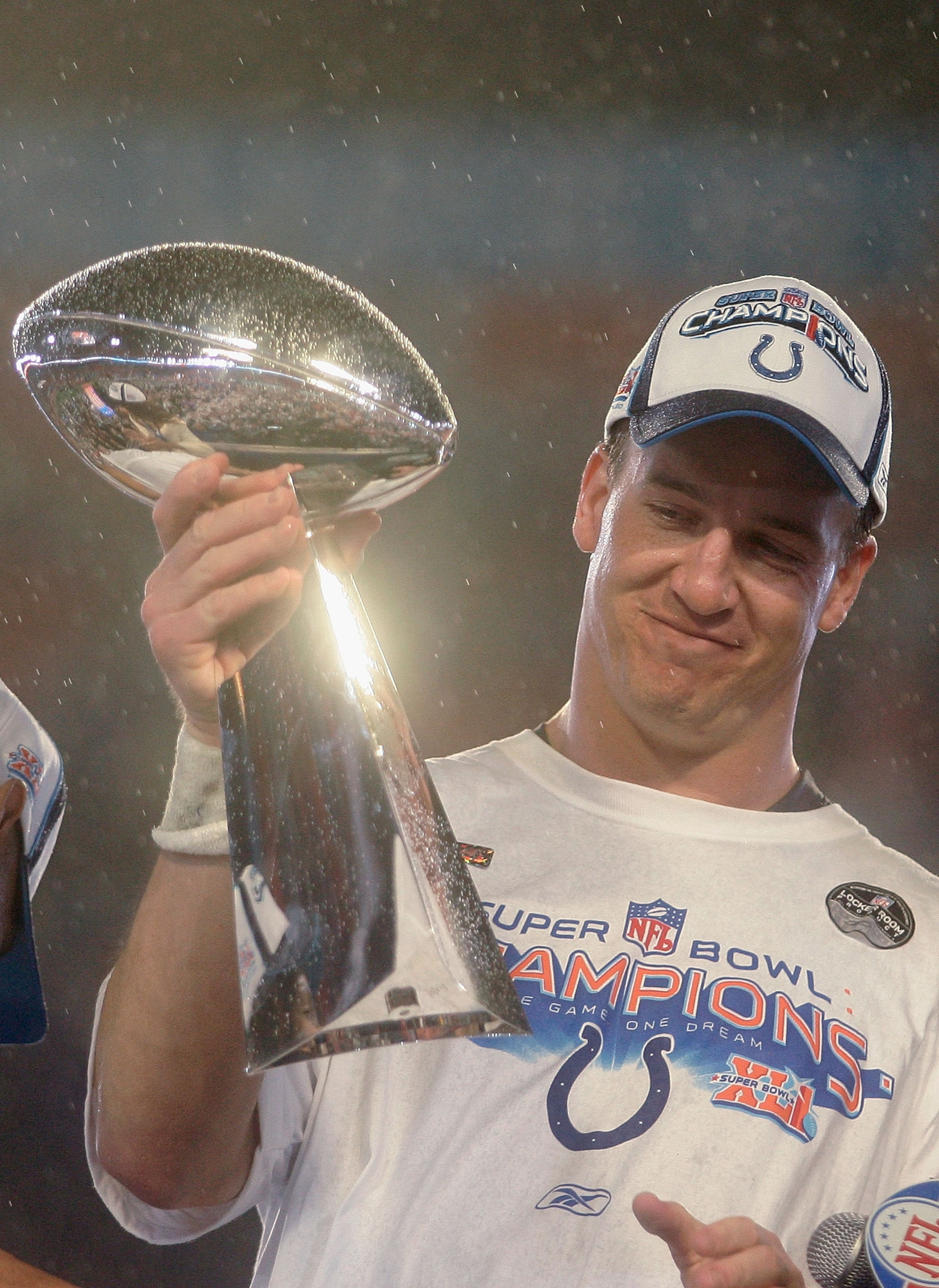 MIAMI GARDENS, FL - FEBRUARY 04:  Quarterback Peyton Manning #18 of the Indianapolis Colts smiles as he holds the Vince Lombardi Super Bowl trophy after his team won the Super Bowl XLI 29-17 over the Chicago Bears on February 4, 2007 at Dolphin Stadium in