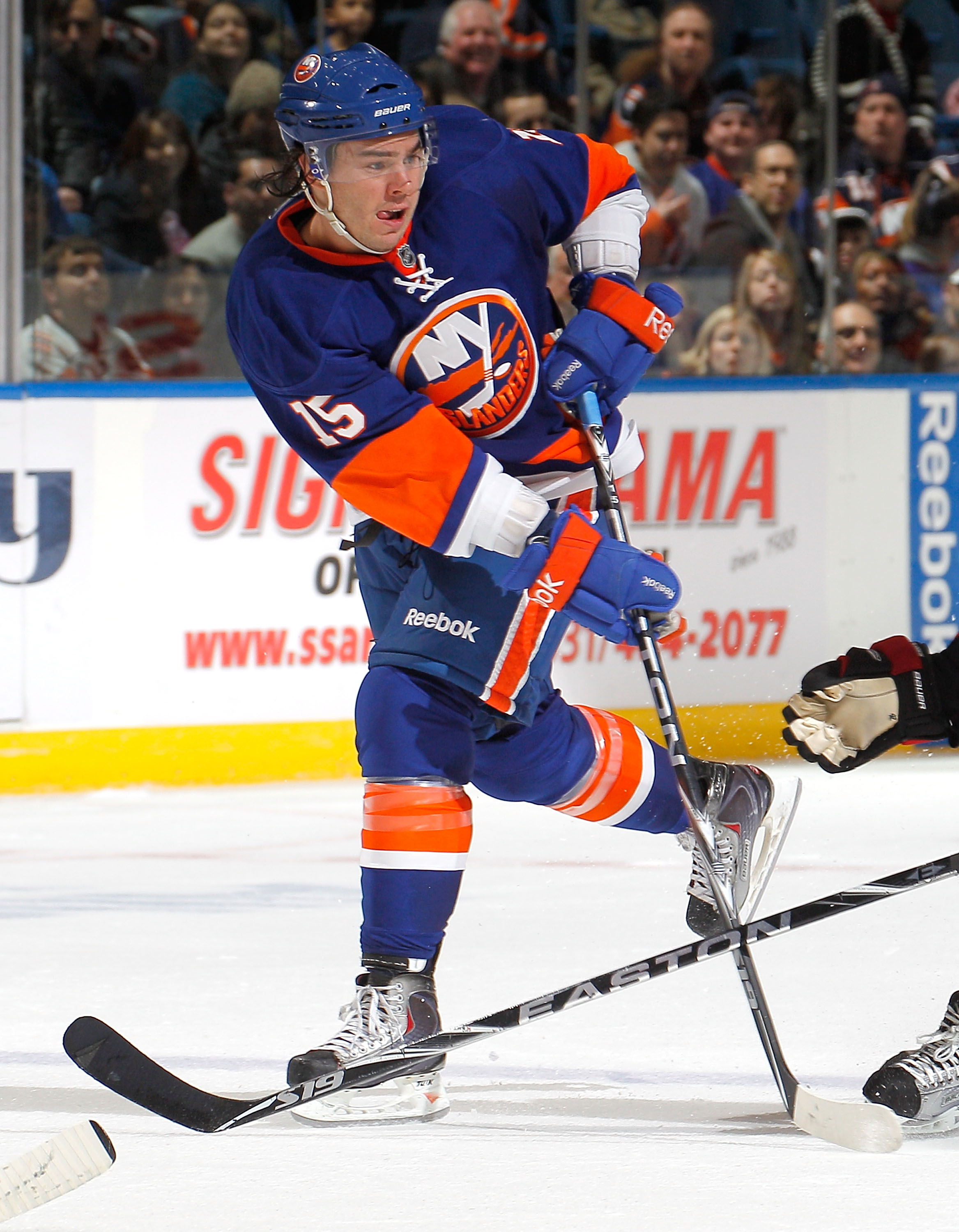UNIONDALE, NY - FEBRUARY 05:  PA Parenteau #15 of the New York Islanders passes during an NHL hockey game against the Ottawa Senators at Nassau Coliseum on February 5, 2011 in Uniondale, New York.  (Photo by Paul Bereswill/Getty Images)
