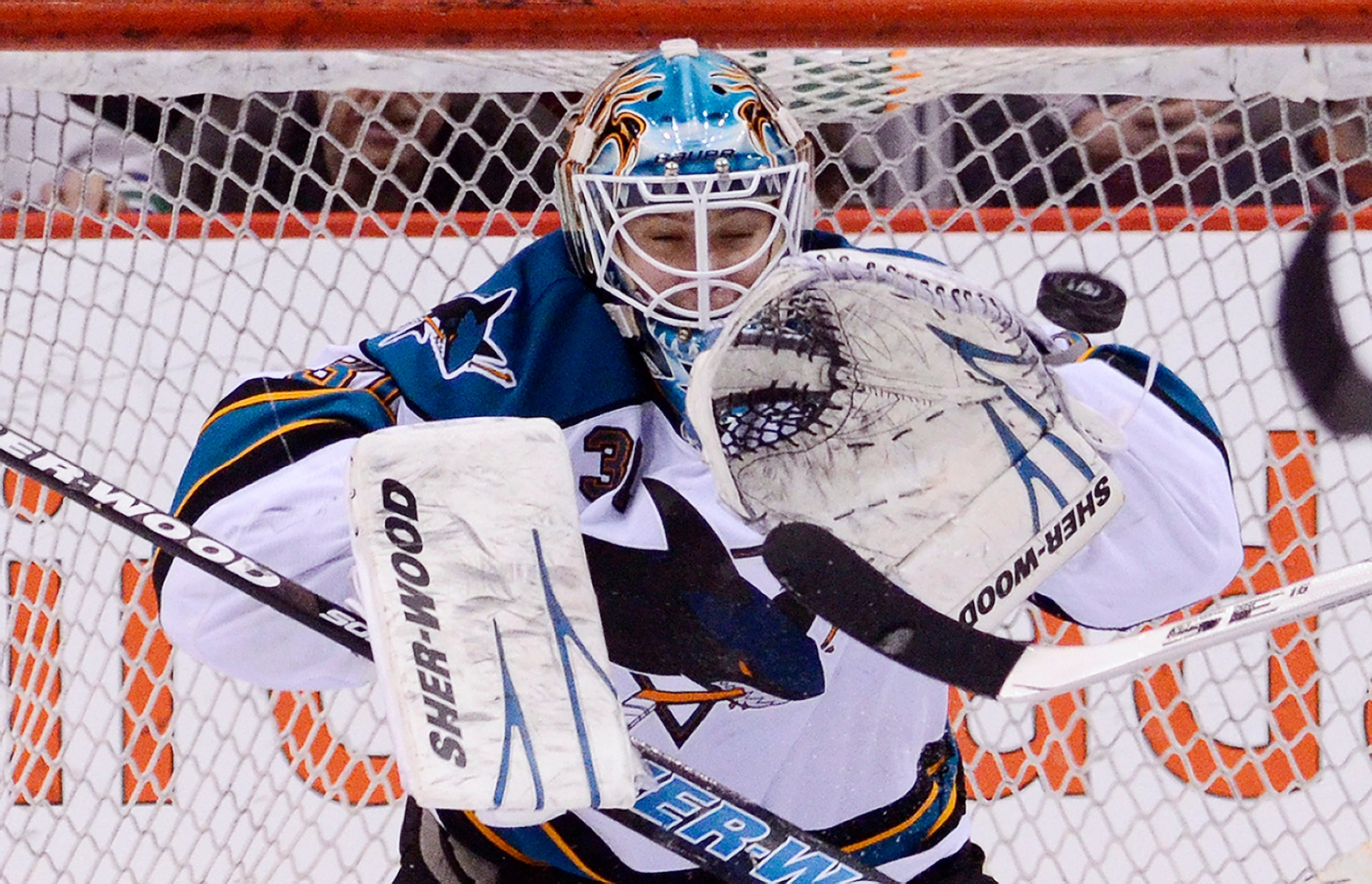 VANCOUVER, CANADA - JANUARY 20: Goalie Antti Niemi #31 of the San Jose Sharks makes a glove save against the Vancouver Canucks during the third period in NHL action on January 20, 2011 at Rogers Arena in Vancouver, BC, Canada.  (Photo by Rich Lam/Getty Im