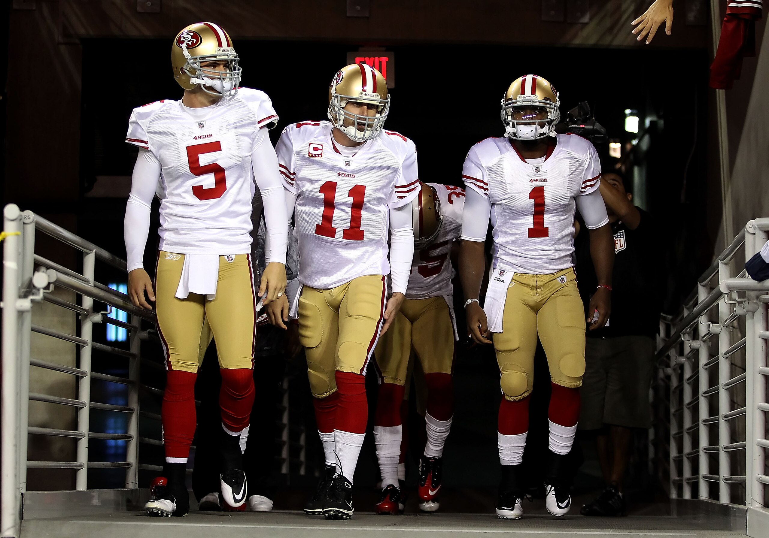 GLENDALE, AZ - NOVEMBER 29: Quarterbacks David Carr #5, Alex Smith #11 and Troy Smith #1 of the San Francisco 49ers walk out onto the field before the NFL game against the Arizona Cardinals at the University of Phoenix Stadium on November 29, 2010 in Gle GLENDALE, AZ - NOVEMBER 29: Quarterbacks David Carr #5, Alex Smith #11 and Troy Smith #1 of the San Francisco 49ers walk out onto the field before the NFL game against the Arizona Cardinals at the University of Phoenix Stadium on November 29, 2010 in Gle