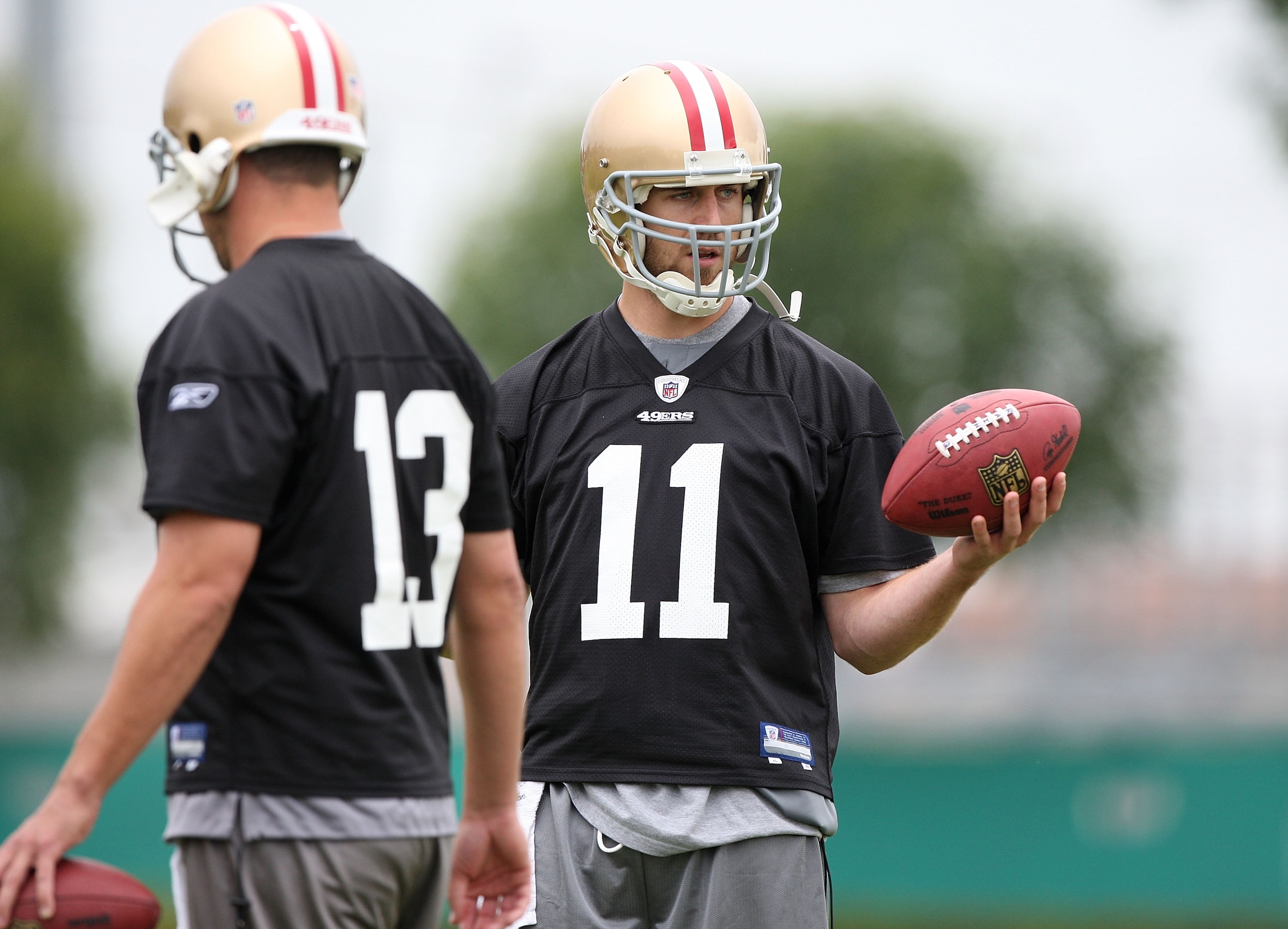 SANTA CLARA, CA - MAY 01: Quarterbacks Alex Smith #11 and Shaun Hill #13 of the San Francisco 49ers look on during the 49ers Minicamp at their training facilities on May 1, 2009 in Santa Clara, California. (Photo by Jed Jacobsohn/Getty Images) SANTA CLARA, CA - MAY 01: Quarterbacks Alex Smith #11 and Shaun Hill #13 of the San Francisco 49ers look on during the 49ers Minicamp at their training facilities on May 1, 2009 in Santa Clara, California. (Photo by Jed Jacobsohn/Getty Images)