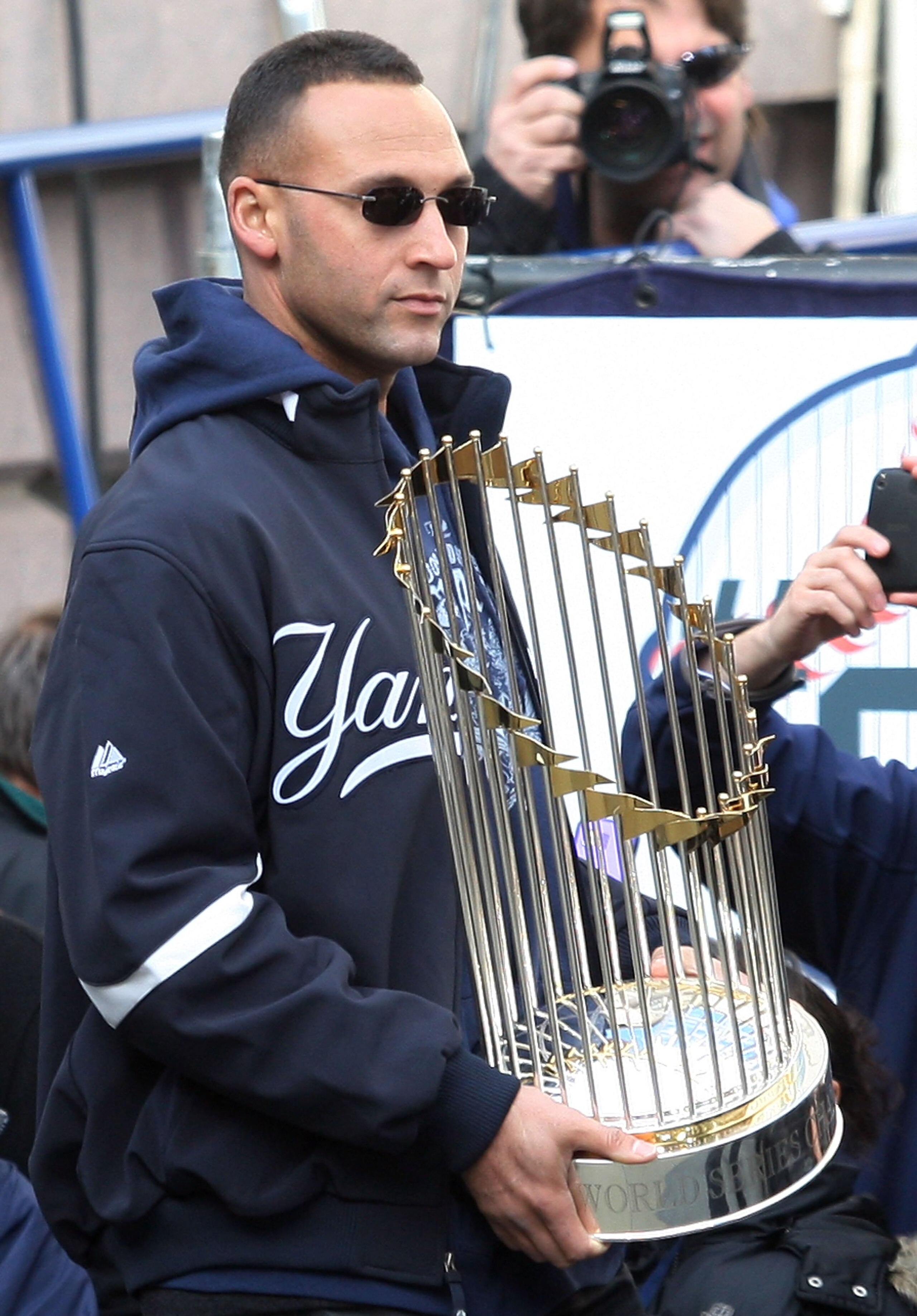 NEW YORK - NOVEMBER 06:  Captain Derek Jeter #2 of the New York Yankees celebrates with the championship trophy during the New York Yankees World Series Victory Celebration at City Hall on November 6, 2009 in New York, New York.  (Photo by Jim McIsaac/Get
