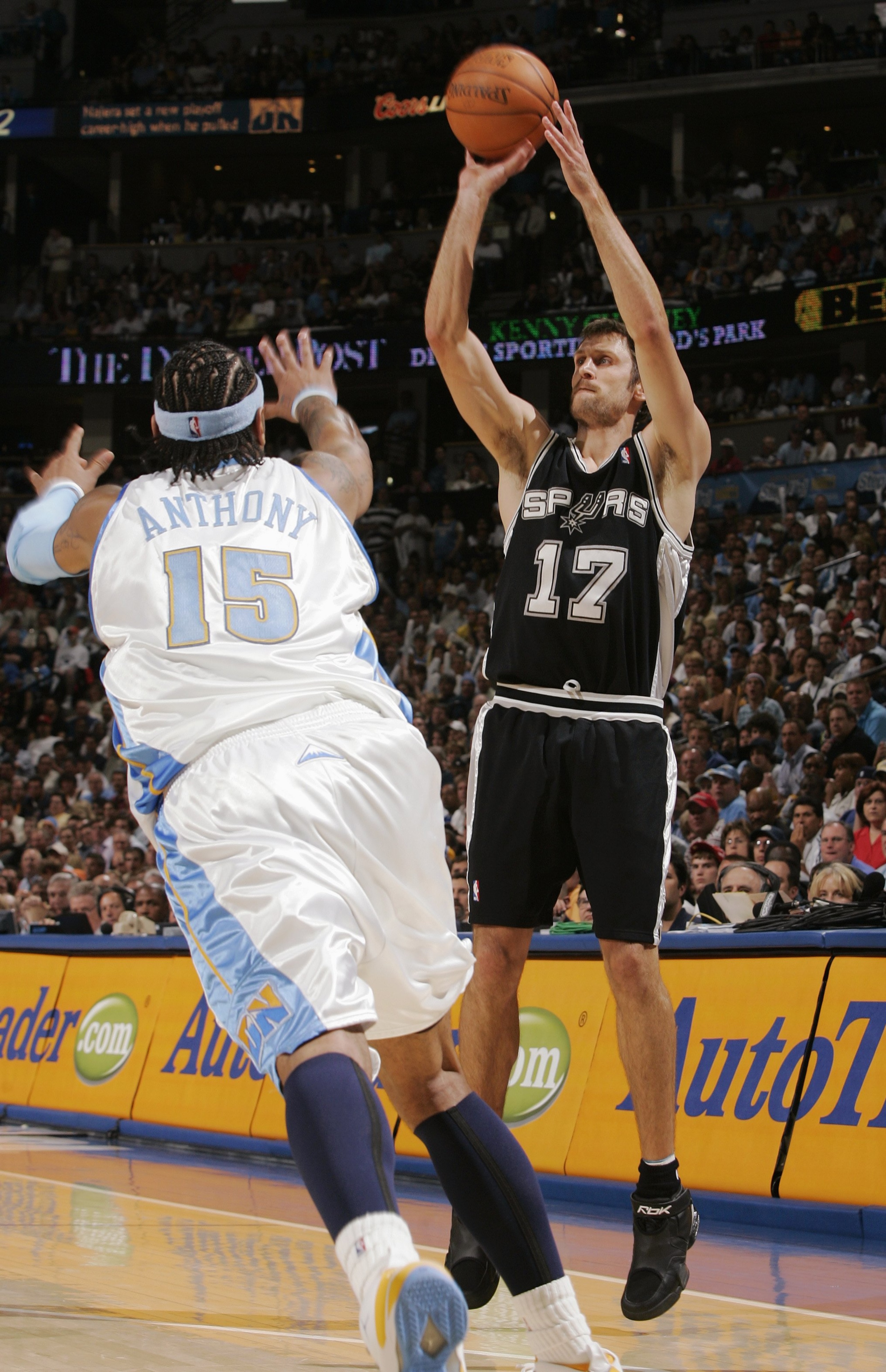 DENVER - APRIL 30:   Brent Barry #17 of the San Antonio Spurs shoots over Carmelo Anthony  #15 of the Denver Nuggets in Game Four of the Western Conference Quarterfinals during the 2007 NBA Playoffs at the Pepsi Center on April 30, 2007 in Denver, Colorad