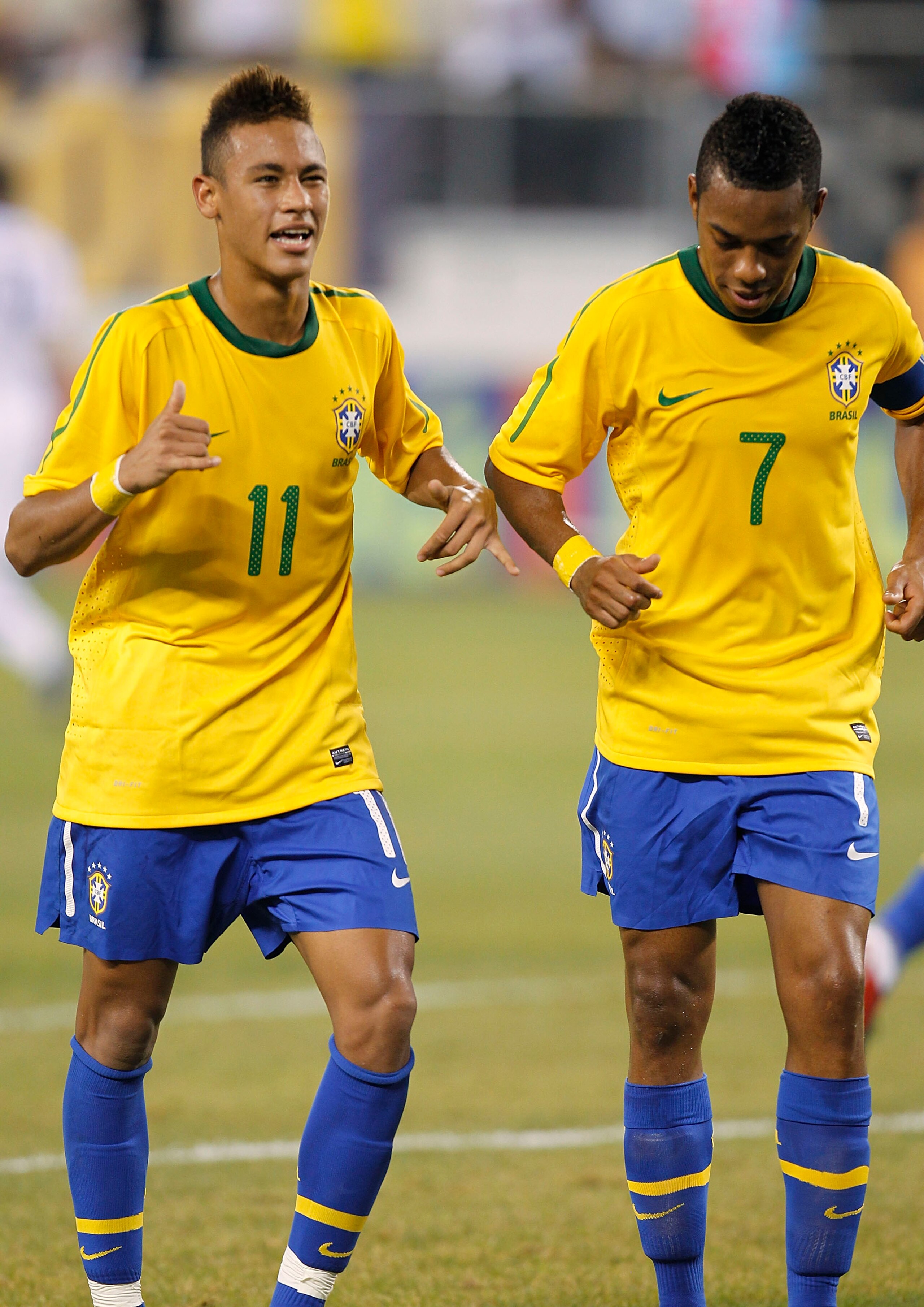 EAST RUTHERFORD, NJ - AUGUST 10: Neymar #11 and Robinho #7 of Brazil celebrate Neymar's goal against the U.S. in the first half of a friendly match at the New Meadowlands on August 10, 2010 in East Rutherford, New Jersey. (Photo by Jeff Zelevansky/Getty I EAST RUTHERFORD, NJ - AUGUST 10: Neymar #11 and Robinho #7 of Brazil celebrate Neymar's goal against the U.S. in the first half of a friendly match at the New Meadowlands on August 10, 2010 in East Rutherford, New Jersey. (Photo by Jeff Zelevansky/Getty I