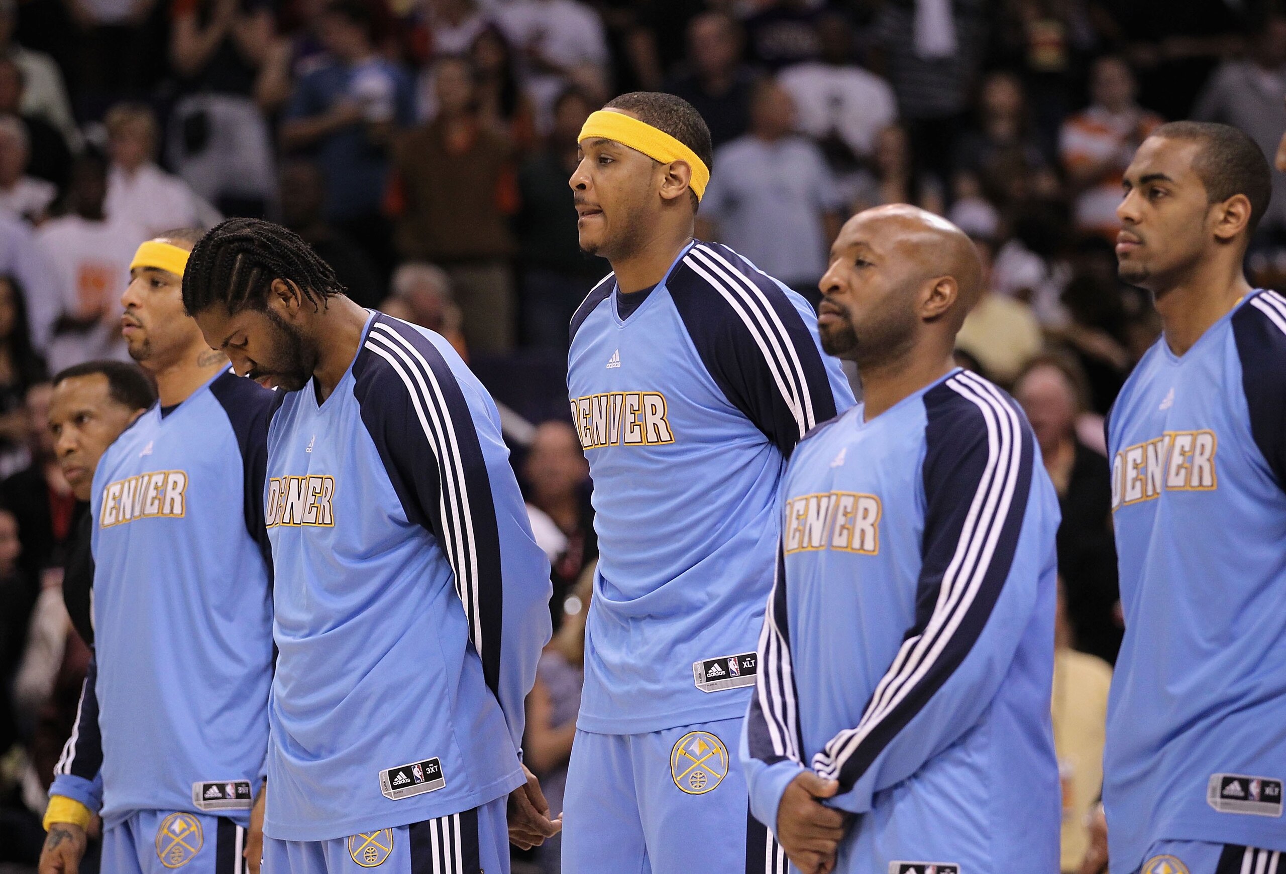 PHOENIX - APRIL 13:  Carmelo Anthony #15 of the Denver Nuggets stands with teammates before the NBA game against the Phoenix Suns at US Airways Center on April 13, 2010 in Phoenix, Arizona. The Suns defeated the Nuggets 123-101.  NOTE TO USER: User expres