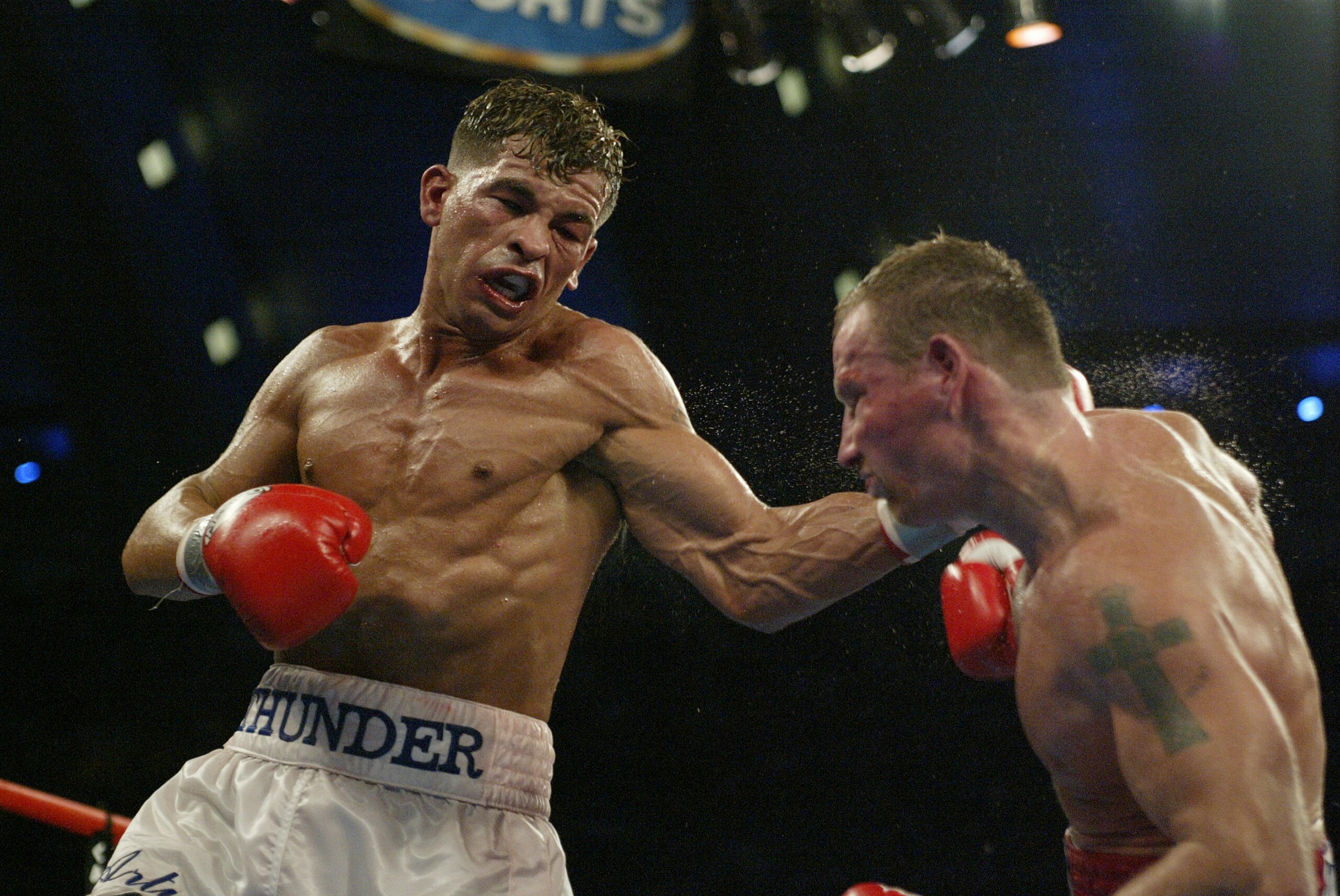 ATLANTIC CITY, NJ - JUNE 7:  Arturo Gatti lands a left hook to Micky Ward during their Junior Welterweight bout at Boardwalk Hall on June 7, 2003 in Atlantic City, New Jersey. Gatti won a unanimous decision. (Photo by Al Bello/Getty Images)