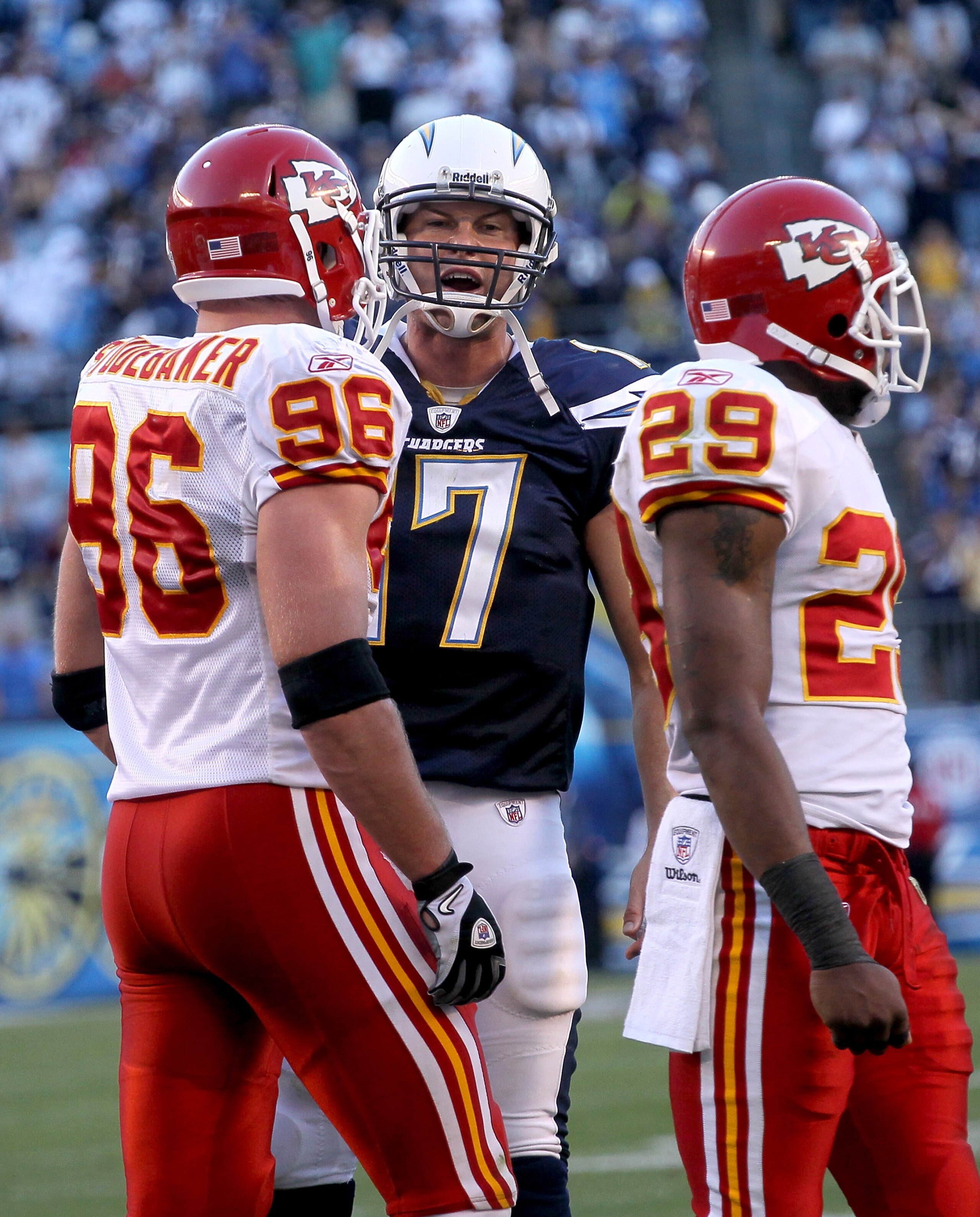 SAN DIEGO - DECEMBER 12:  Quarterbaqck Philip Rivers #17 of the San Diego Chargers talks to linebacker Andy Studebaker #96 and safety Eric Berry #29 of the Kansas City Chiefs after a Charger touchdown put them up 31-0 at Qualcomm Stadium on December 12, 2