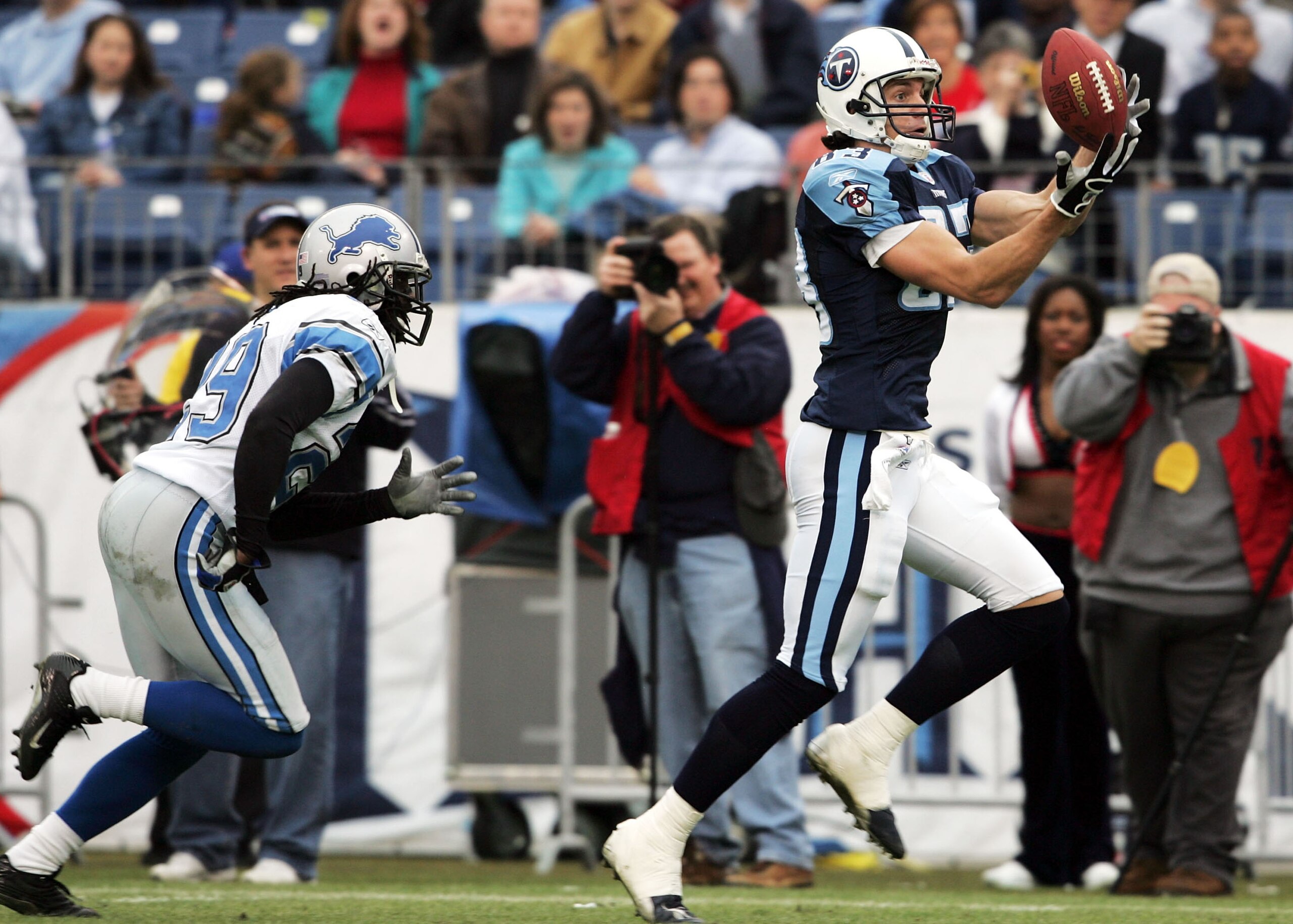 NASHVILLE, TN - JANUARY 2:  Drew Bennett #83 of the Tennessee Titans catches a touchdown pass against the Detroit Lions on January 2, 2005 at The Coliseum in Nashville, Tennessee.  (Photo by Andy Lyons/Getty Images)