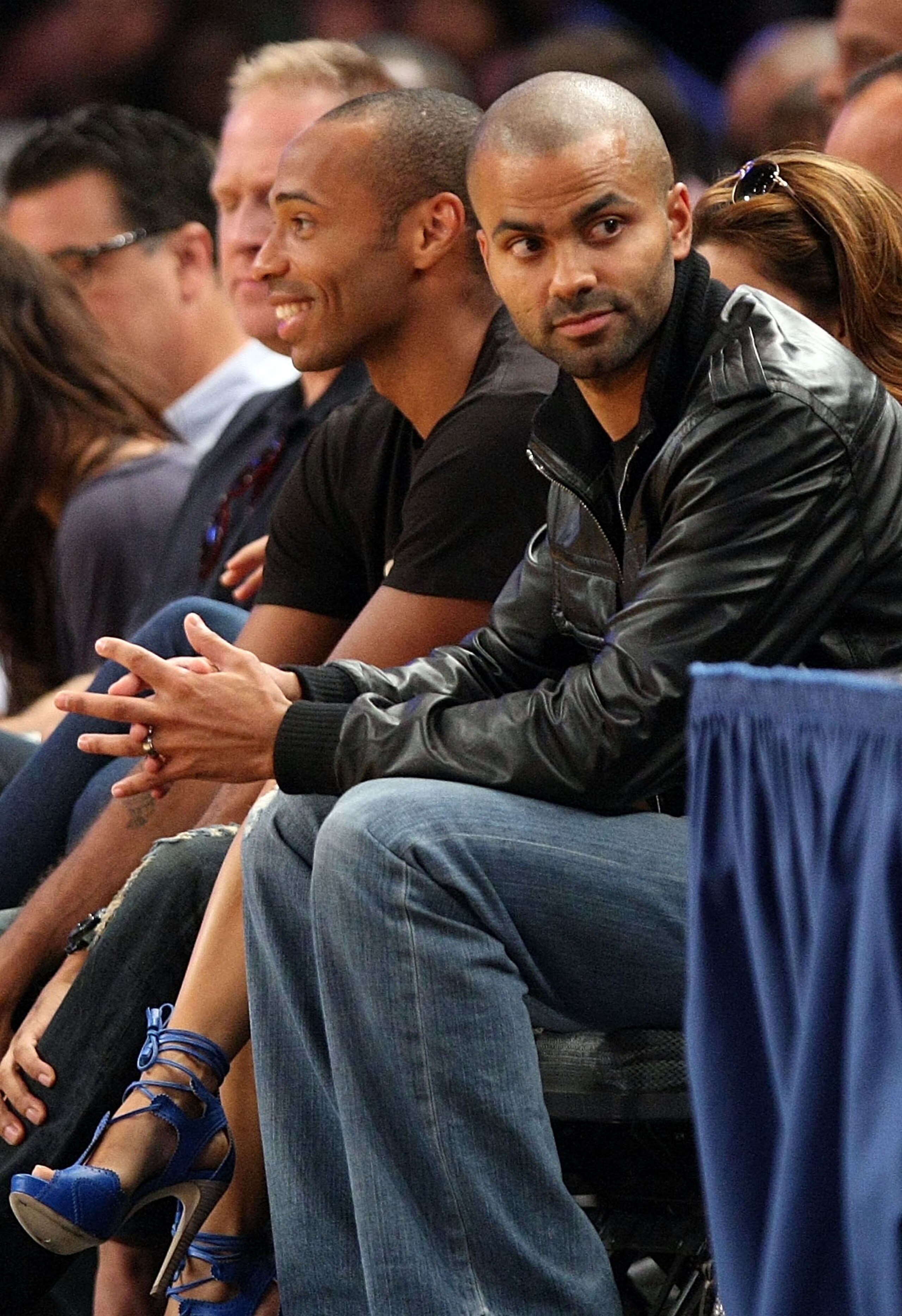 NEW YORK - AUGUST 15:  Thierry Henry and Tony Parker watch on during the United States and France exhibition game as part of the World Basketball Festival at Madison Square Garden on August 15, 2010 in New York City.  (Photo by Nick Laham/Getty Images)