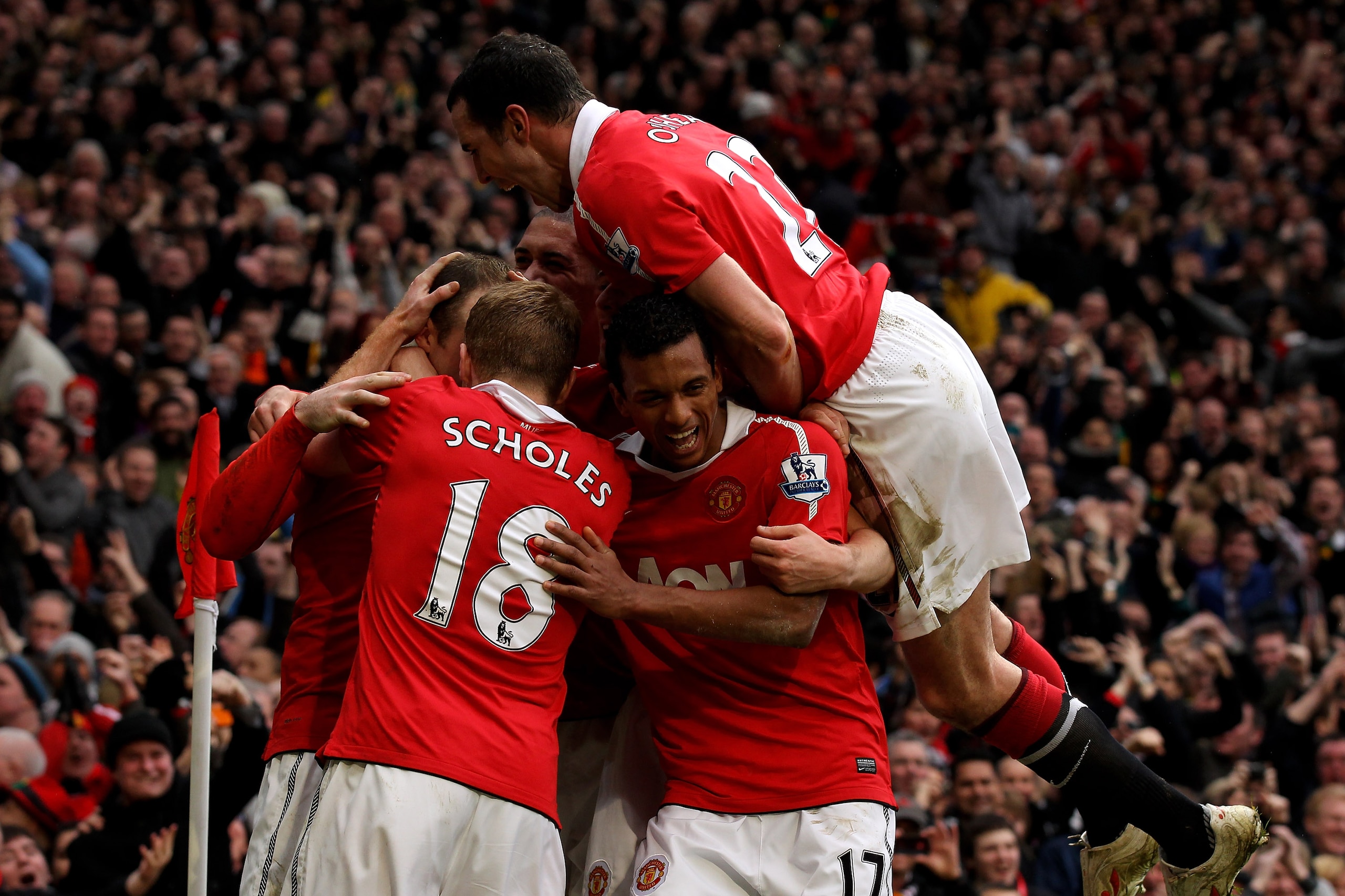 MANCHESTER, ENGLAND - FEBRUARY 12: Wayne Rooney of Manchester United is mobbed by teammates after scoring during the Barclays Premier League match between Manchester United and Manchester City at Old Trafford on February 12, 2011 in Manchester, England. MANCHESTER, ENGLAND - FEBRUARY 12: Wayne Rooney of Manchester United is mobbed by teammates after scoring during the Barclays Premier League match between Manchester United and Manchester City at Old Trafford on February 12, 2011 in Manchester, England.