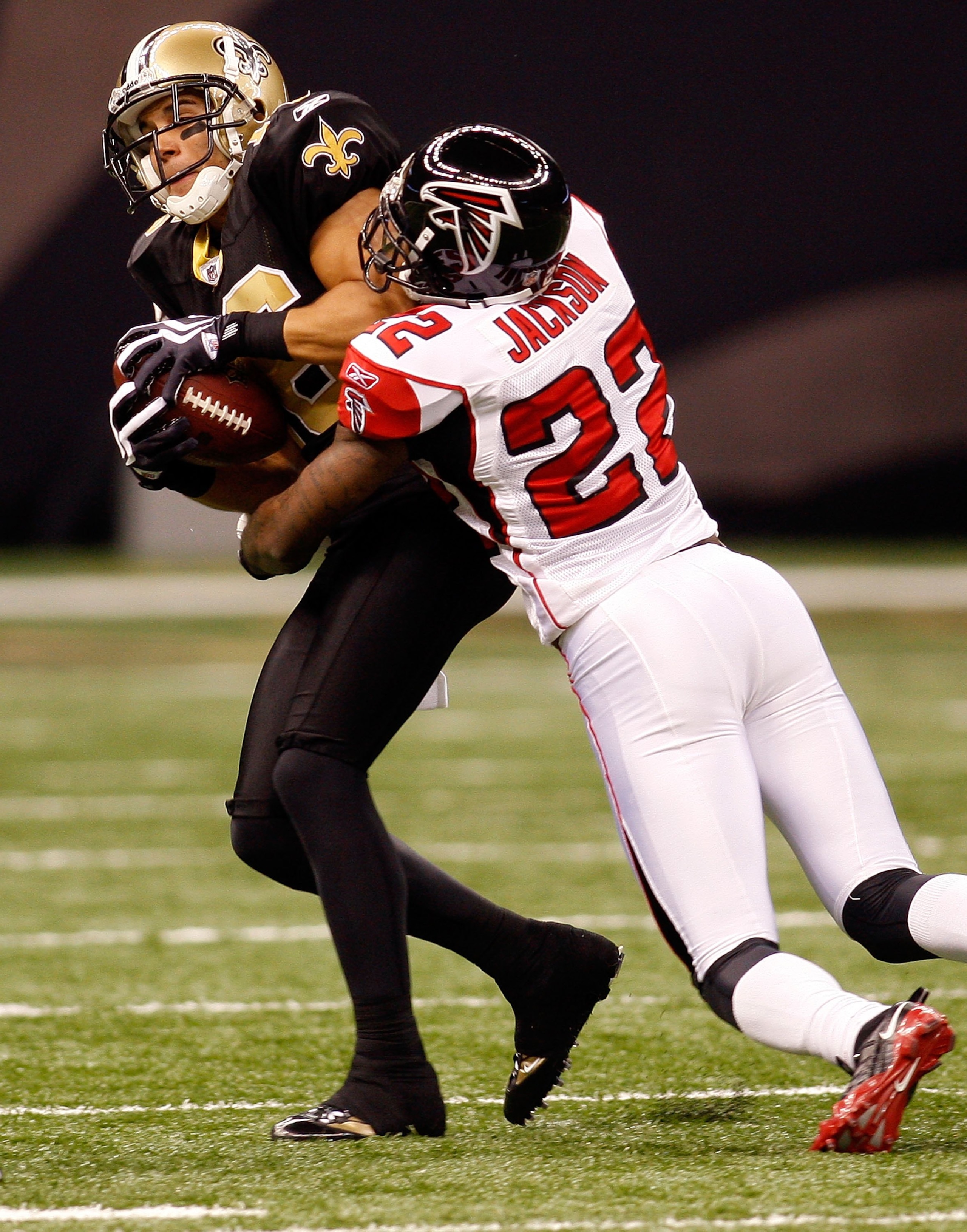 NEW ORLEANS - NOVEMBER 02:  Lance Moore #16 of the New Orleans Saints is tackled by Chevis Jackson #22 of the Atlanta Falcons at Louisana Superdome on November 2, 2009 in New Orleans, Louisiana.  (Photo by Chris Graythen/Getty Images)