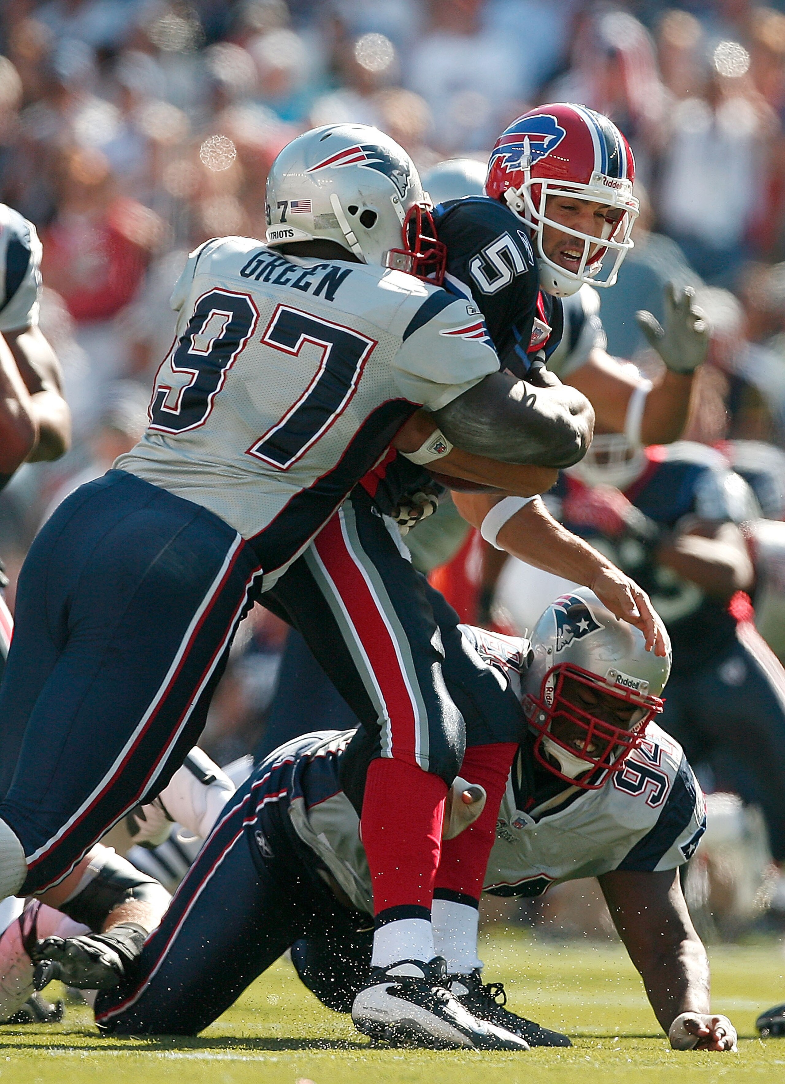 FOXBORO, MA - SEPTEMBER 23:  Quarterback Trent Edwards #5 of the Buffalo Bills is sacked by Jarvis Green #97 of the New England Patriots during a game against the Buffalo Bills at Gillette Stadium September 23, 2007 in Foxboro, Massachusetts.  (Photo by J