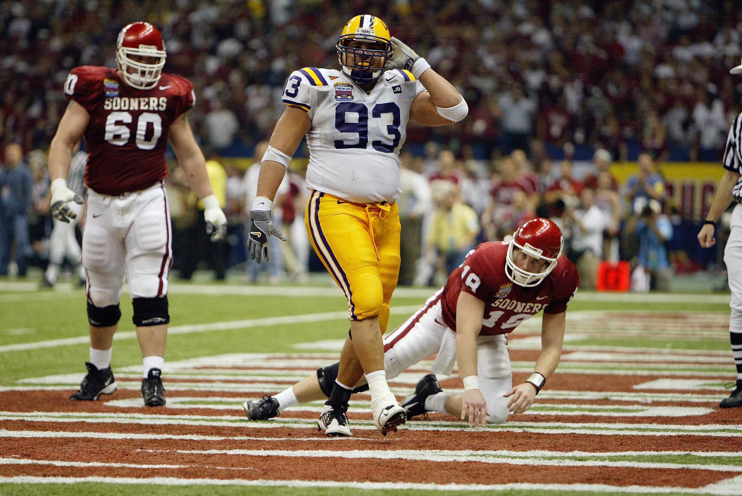 NEW ORLEANS - JANUARY 4:  Defensive tackle Chad Lavalais #93 of the Louisiana State Tigers celebrates after stopping quarterback Jason White #18 and the rest of the Oklahoma Sooners offense in the Nokia Sugar Bowl National Championship on January 4, 2004