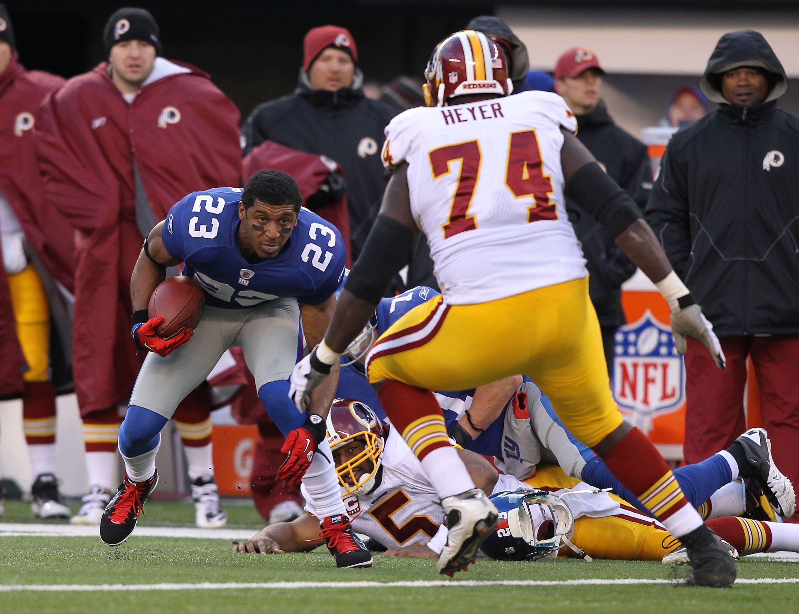 EAST RUTHERFORD, NJ - DECEMBER 05:  Dave Tollefson #71 of the New York Giants sacks Donovan McNabb #5 of the Washington Redskins who fumbles and the ball is recovered by Corey Webster #23 during their game on December 5, 2010 at The New Meadowlands Stadiu