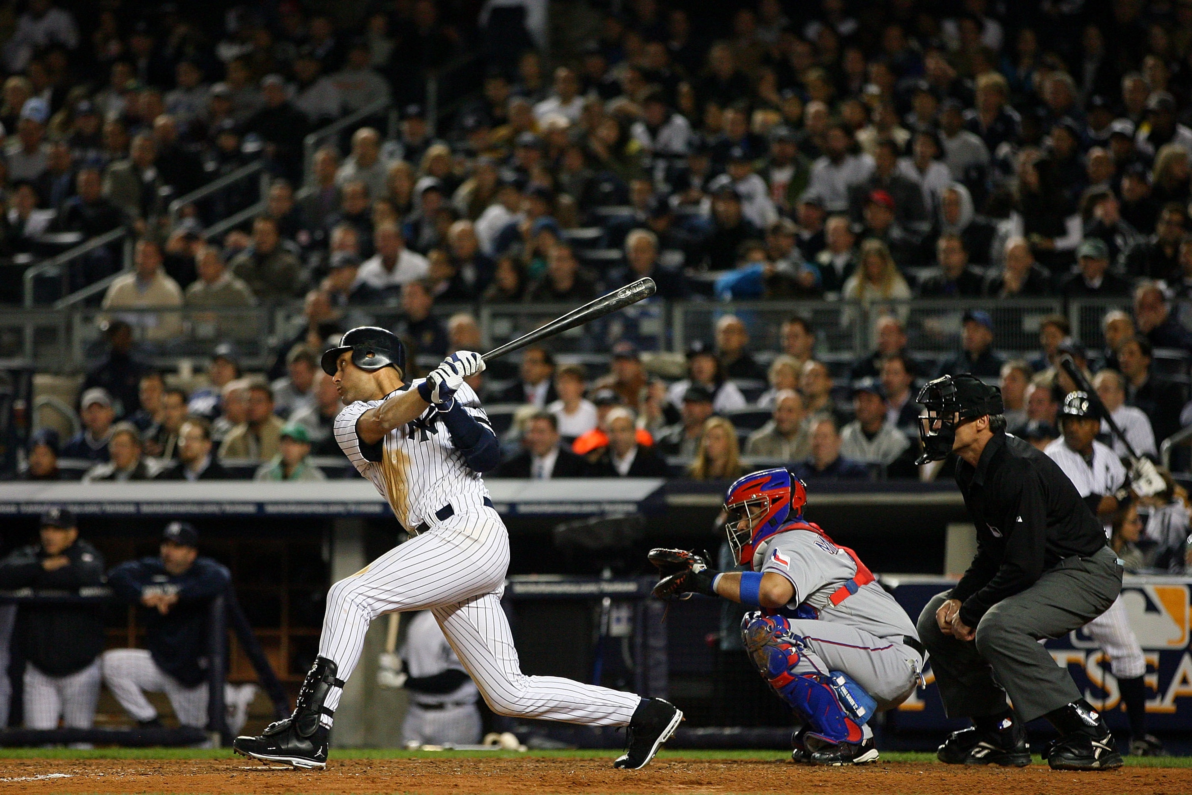 NEW YORK - OCTOBER 19:  Derek Jeter #2 of the New York Yankees hits a double in the fifth inning against the Texas Rangers in Game Four of the ALCS during the 2010 MLB Playoffs at Yankee Stadium on October 19, 2010 in the Bronx borough of New York City.