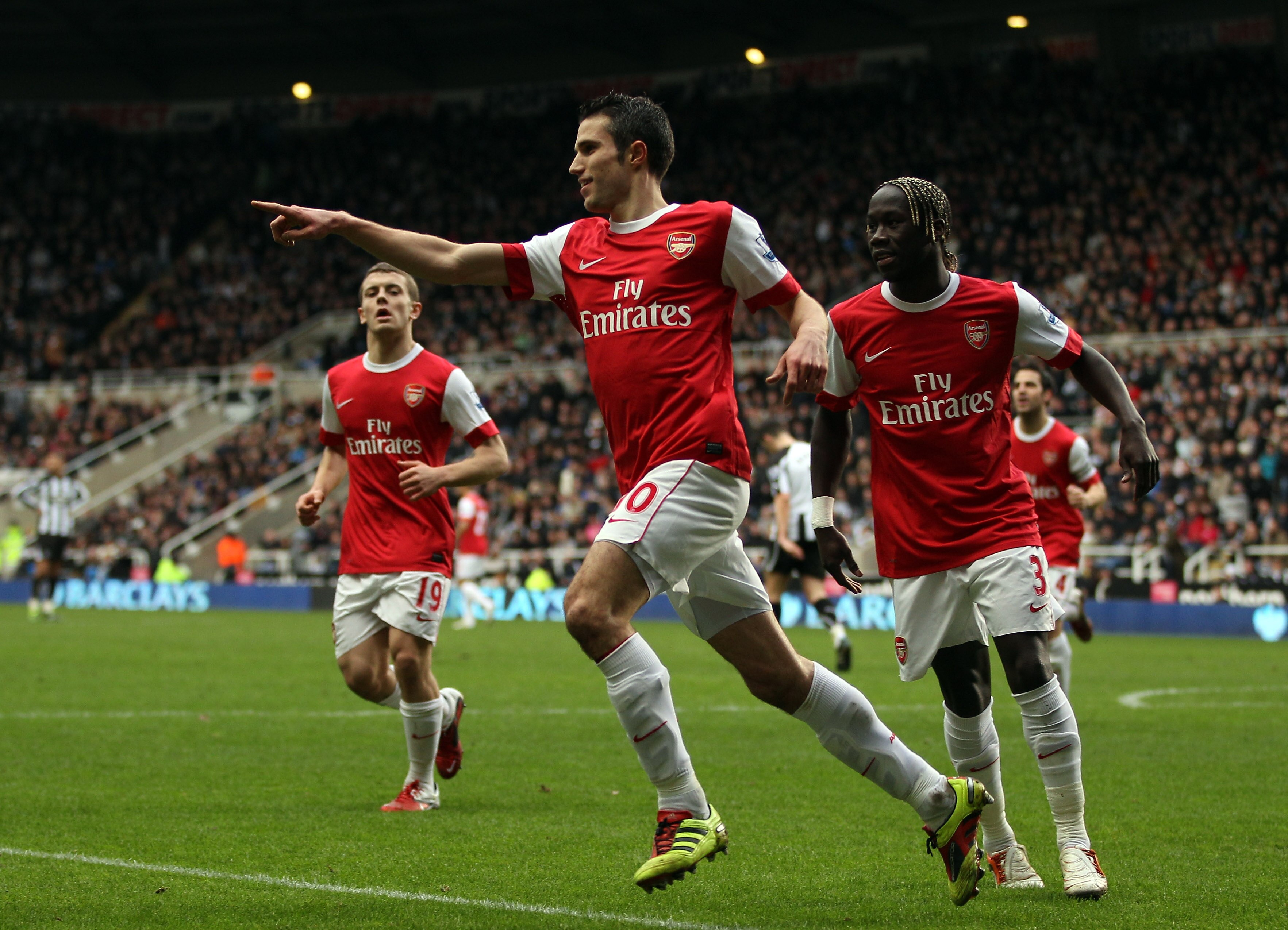 NEWCASTLE UPON TYNE, ENGLAND - FEBRUARY 05:  Robin Van Persie of Arsenal celebrates scoring the third goal during the Barclays Premier League match between Newcastle United and Arsenal at St James' Park on February 5, 2011 in Newcastle upon Tyne, England.