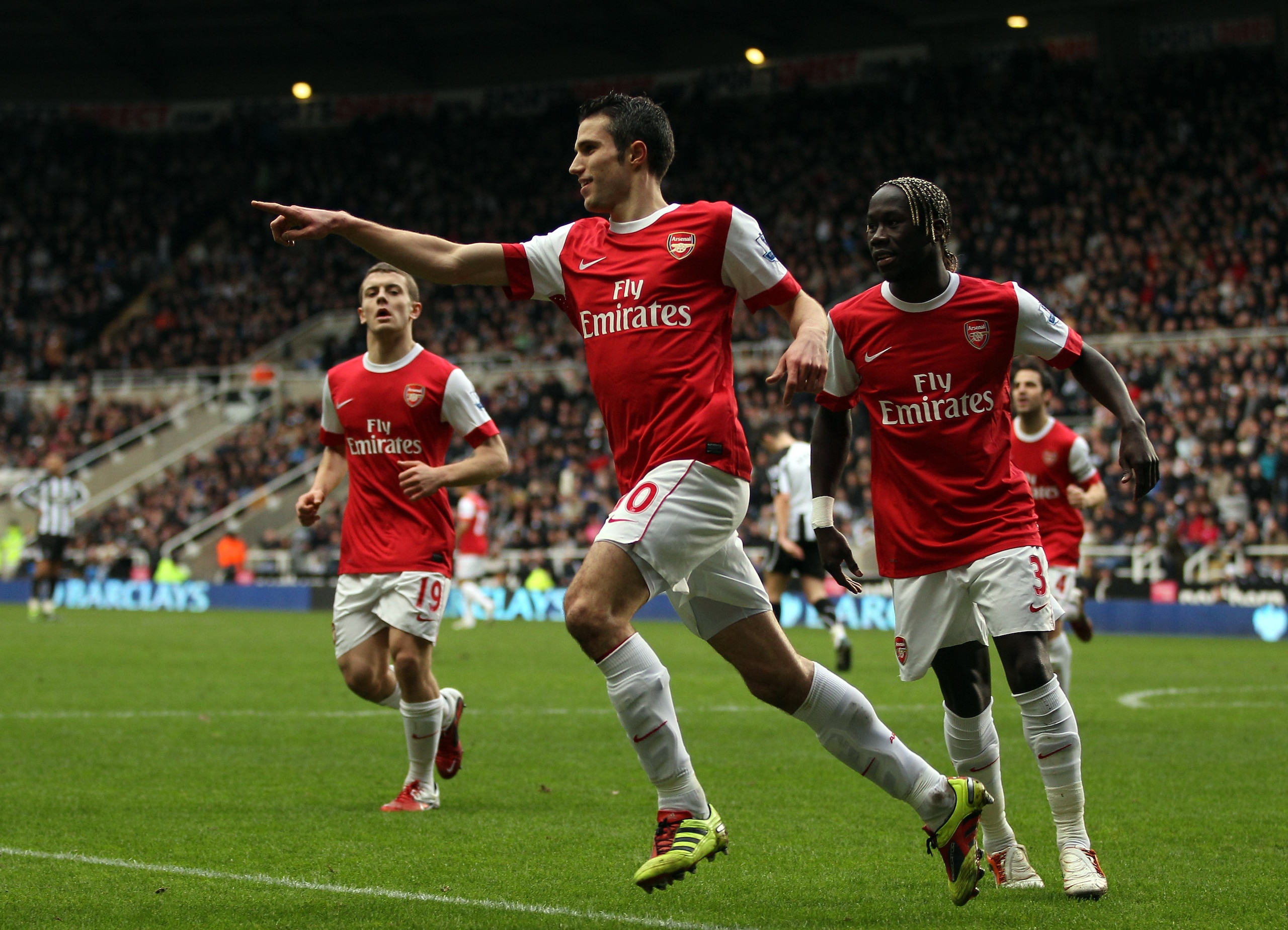 NEWCASTLE UPON TYNE, ENGLAND - FEBRUARY 05: Robin Van Persie of Arsenal celebrates scoring the third goal during the Barclays Premier League match between Newcastle United and Arsenal at St James' Park on February 5, 2011 in Newcastle upon Tyne, England. NEWCASTLE UPON TYNE, ENGLAND - FEBRUARY 05: Robin Van Persie of Arsenal celebrates scoring the third goal during the Barclays Premier League match between Newcastle United and Arsenal at St James' Park on February 5, 2011 in Newcastle upon Tyne, England.