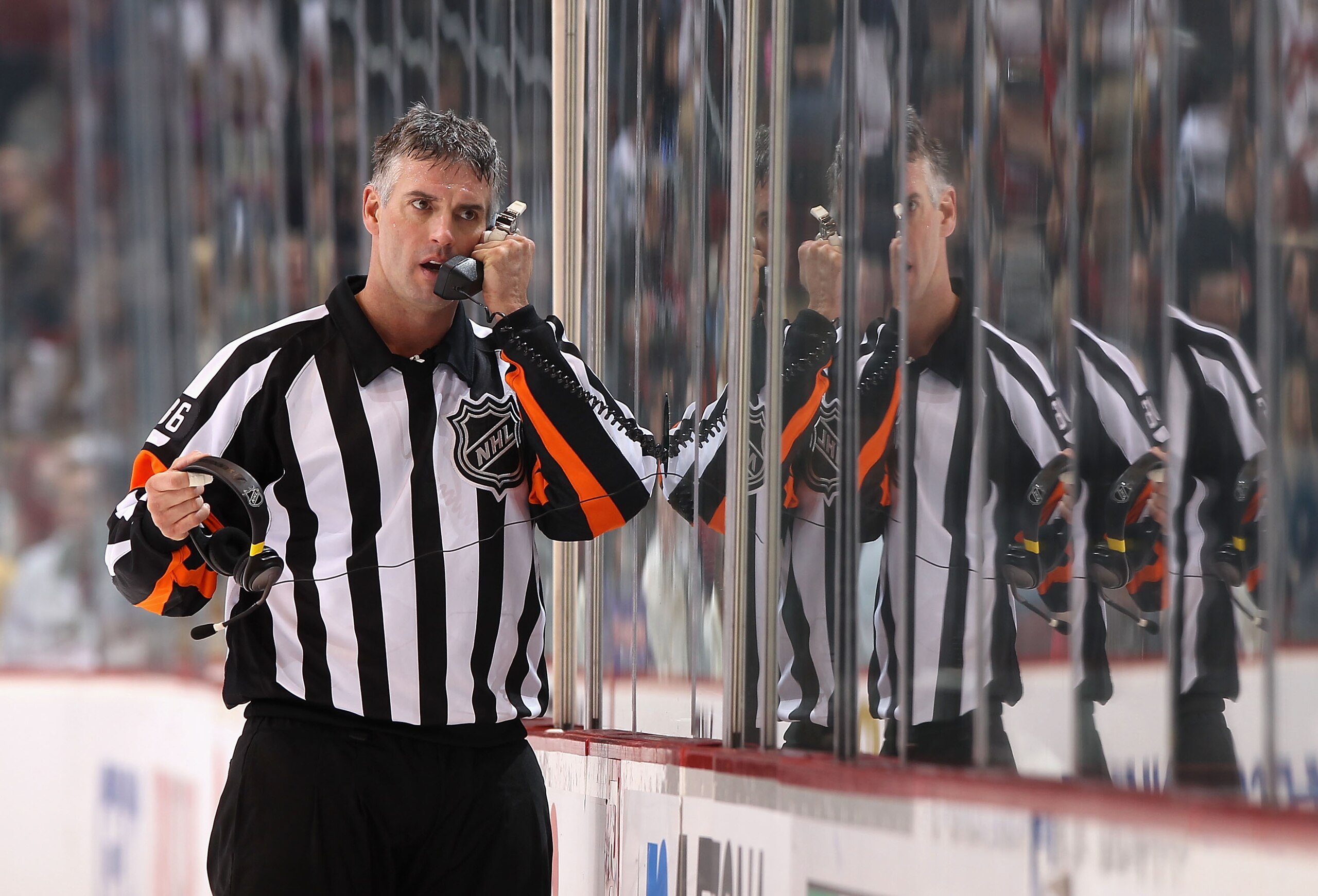 GLENDALE, AZ - JANUARY 22:  Referee Dean Morton #36 talks on the phone during the NHL game between the Los Angeles Kings and the Phoenix Coyotes at Jobing.com Arena on January 22, 2011 in Glendale, Arizona.  The Kings defeated the Coyotes 4-3.  (Photo by