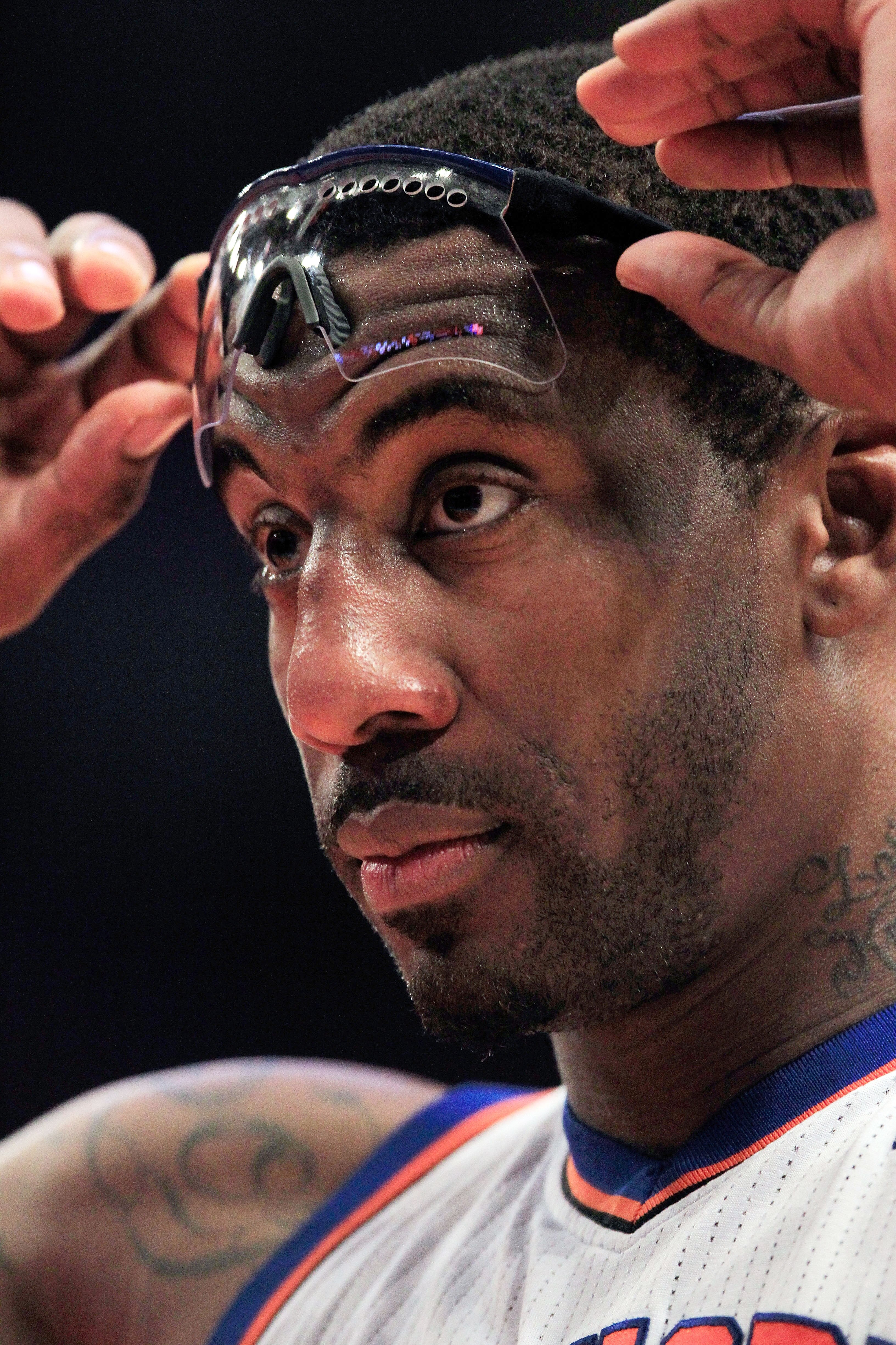 NEW YORK, NY - FEBRUARY 06:  Amar'e Stoudemire #1 of the New York Knicks adjusts his glasses on the court against the Philadelphia 76ers at Madison Square Garden on February 6, 2011 in New York City. NOTE TO USER: User expressly acknowledges and agrees th