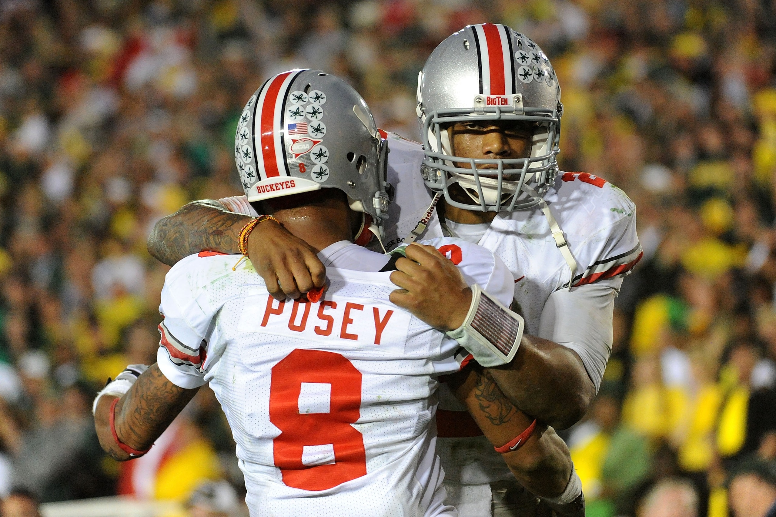 PASADENA, CA - JANUARY 01:  Quarterback Terrelle Pryor #2 of the Ohio State Buckeyes celebrates with wide receiver DeVier Posey #8 after a touchdown in the fourth quarter of the 96th Rose Bowl game against the Oregon Ducks on January 1, 2010 in Pasadena,
