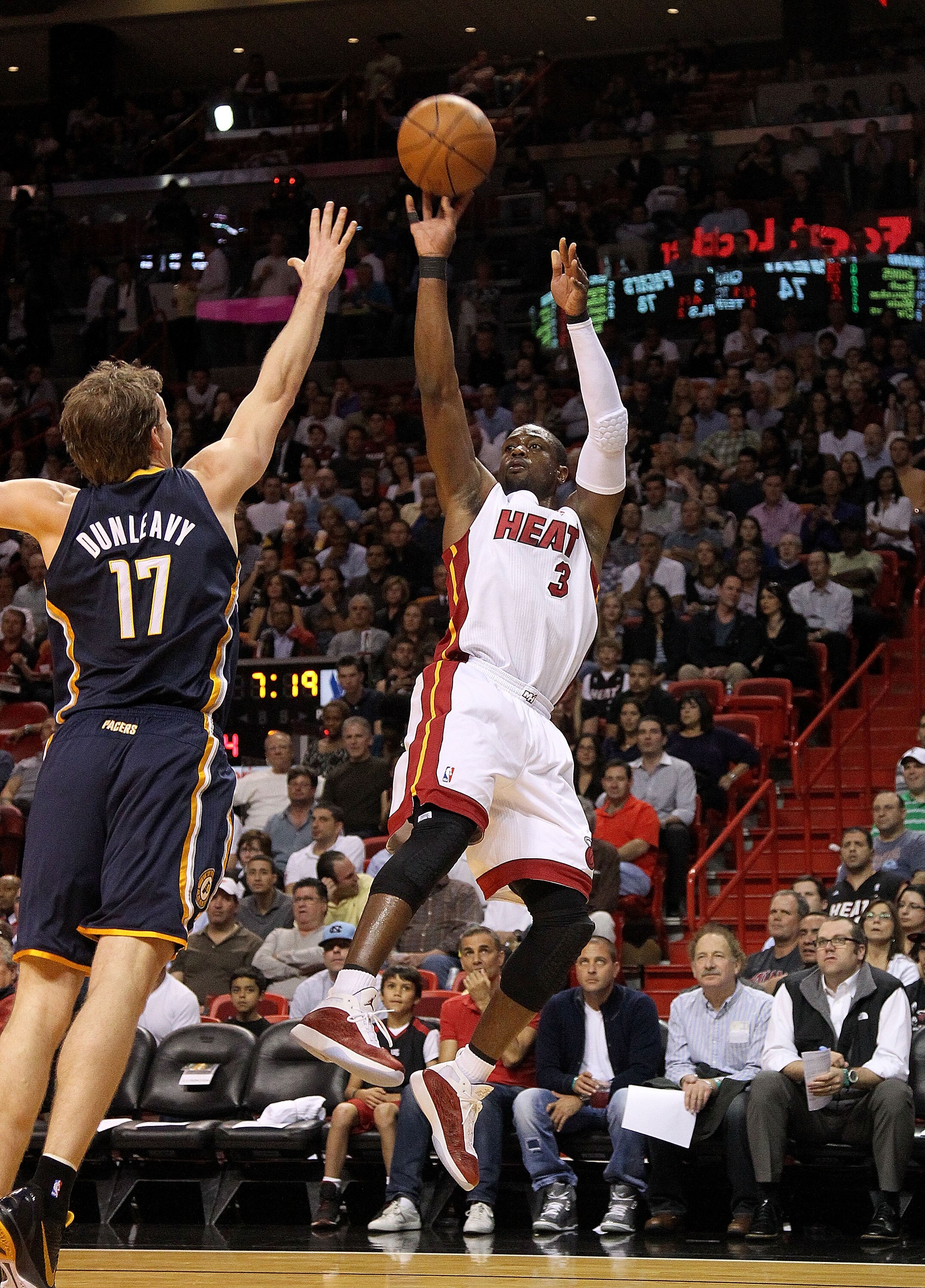 MIAMI, FL - FEBRUARY 08:  Dwyane Wade #3 of the Miami Heat shoots a jumper over Mike Dunleavy #17 of the Indiana Pacers during a game at American Airlines Arena on February 8, 2011 in Miami, Florida. NOTE TO USER: User expressly acknowledges and agrees th