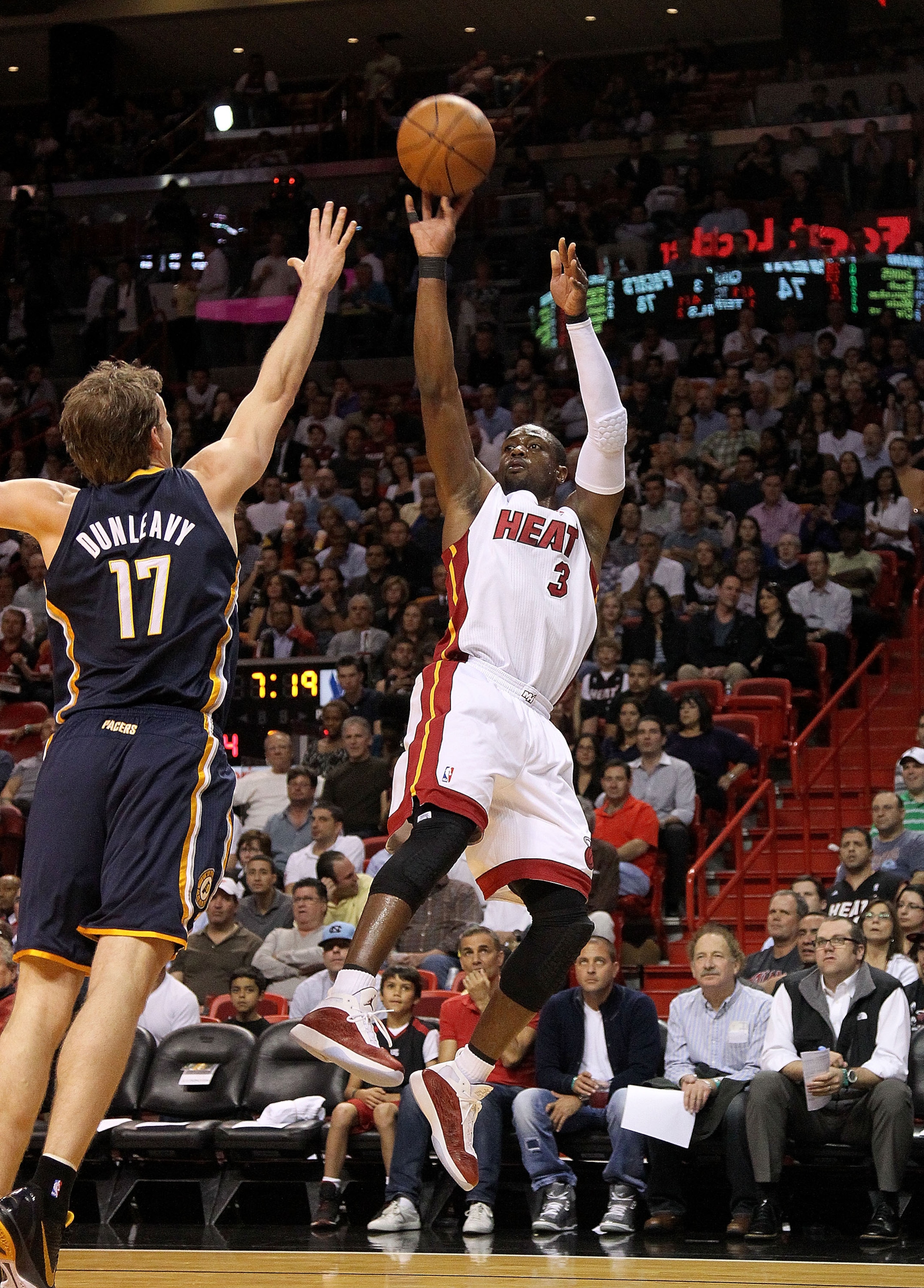 MIAMI, FL - FEBRUARY 08:  Dwyane Wade #3 of the Miami Heat shoots a jumper over Mike Dunleavy #17 of the Indiana Pacers during a game at American Airlines Arena on February 8, 2011 in Miami, Florida. NOTE TO USER: User expressly acknowledges and agrees th