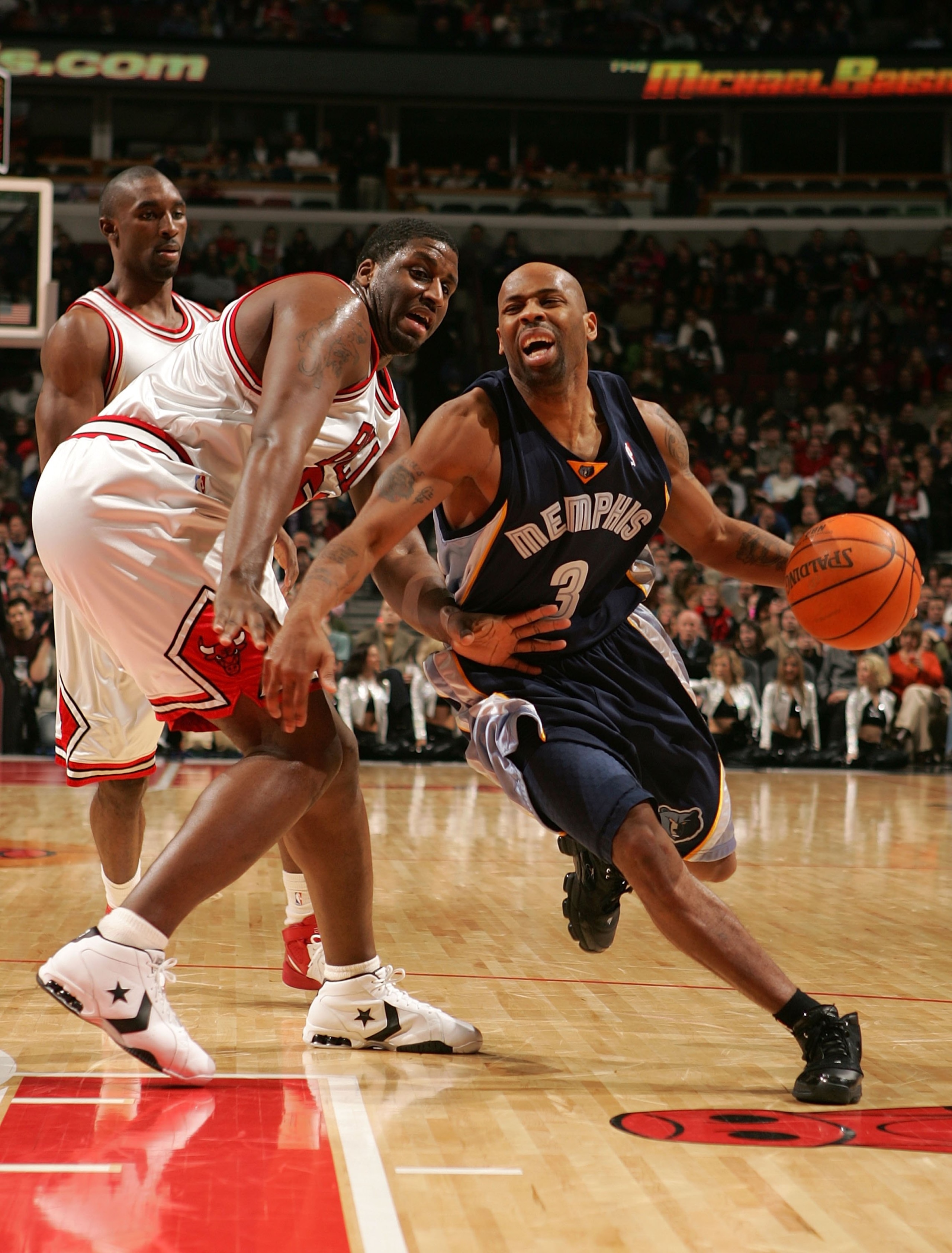 CHICAGO - JANUARY 13: Chucky Atkins #3 of the Memphis Grizzlies drives against Michael Sweetney #50 and Ben Gordon #7 of the Chicago Bulls January 13, 2007 at the United Center in Chicago, Illinois. NOTE TO USER: User expressly acknowledges and agrees t CHICAGO - JANUARY 13: Chucky Atkins #3 of the Memphis Grizzlies drives against Michael Sweetney #50 and Ben Gordon #7 of the Chicago Bulls January 13, 2007 at the United Center in Chicago, Illinois. NOTE TO USER: User expressly acknowledges and agrees t