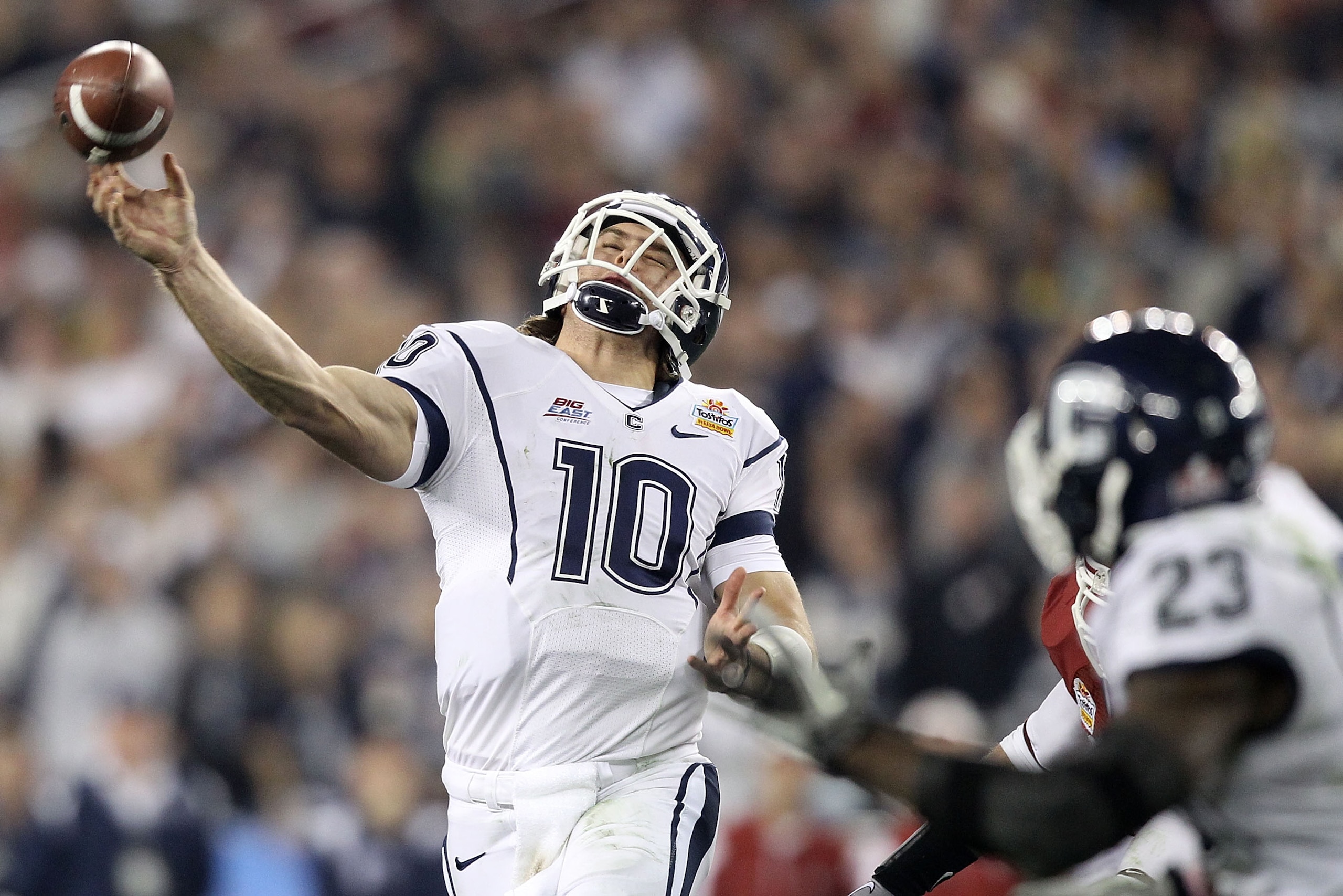 GLENDALE, AZ - JANUARY 01:  Zach Frazer #10 of the Connecticut Huskies looks to throw the ball to Jordan Todman #23 of the Connecticut Huskies in the second half during the Tostitos Fiesta Bowl at the Universtity of Phoenix Stadium on January 1, 2011 in G