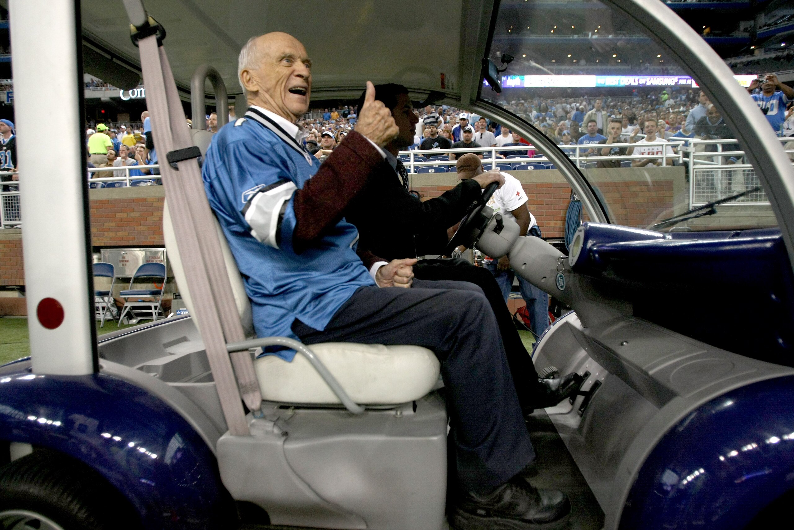 DETROIT - SEPTEMBER 20:  Detroit Tigers broadcast legend Ernie Harwell rides off the field after performing the coin toss for the game between the Detroit Lions and the Minnesota Vikings at Ford Field on September 20, 2009 in Detroit, Michigan. The Viking