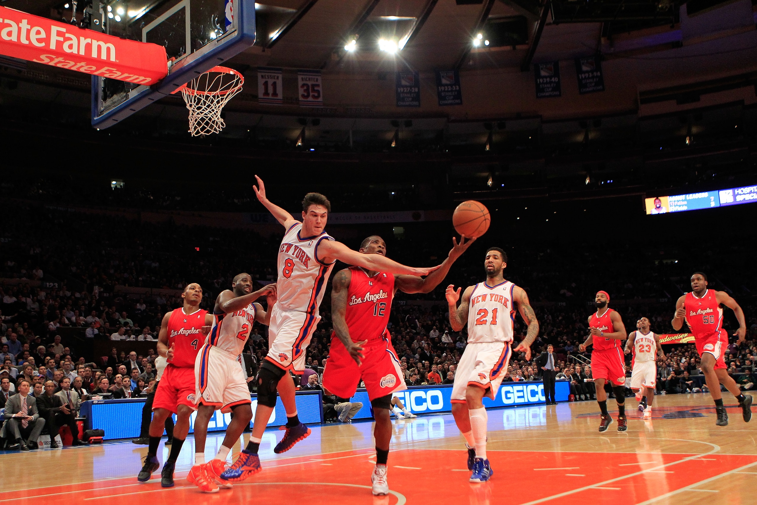 NEW YORK, NY - FEBRUARY 09:  Danilo Gallinari #8 of the New York Knicks fouls Eric Bledsoe #12 of the Los Angeles Clippers at Madison Square Garden on February 9, 2011 in New York City. NOTE TO USER: User expressly acknowledges and agrees that, by downloa