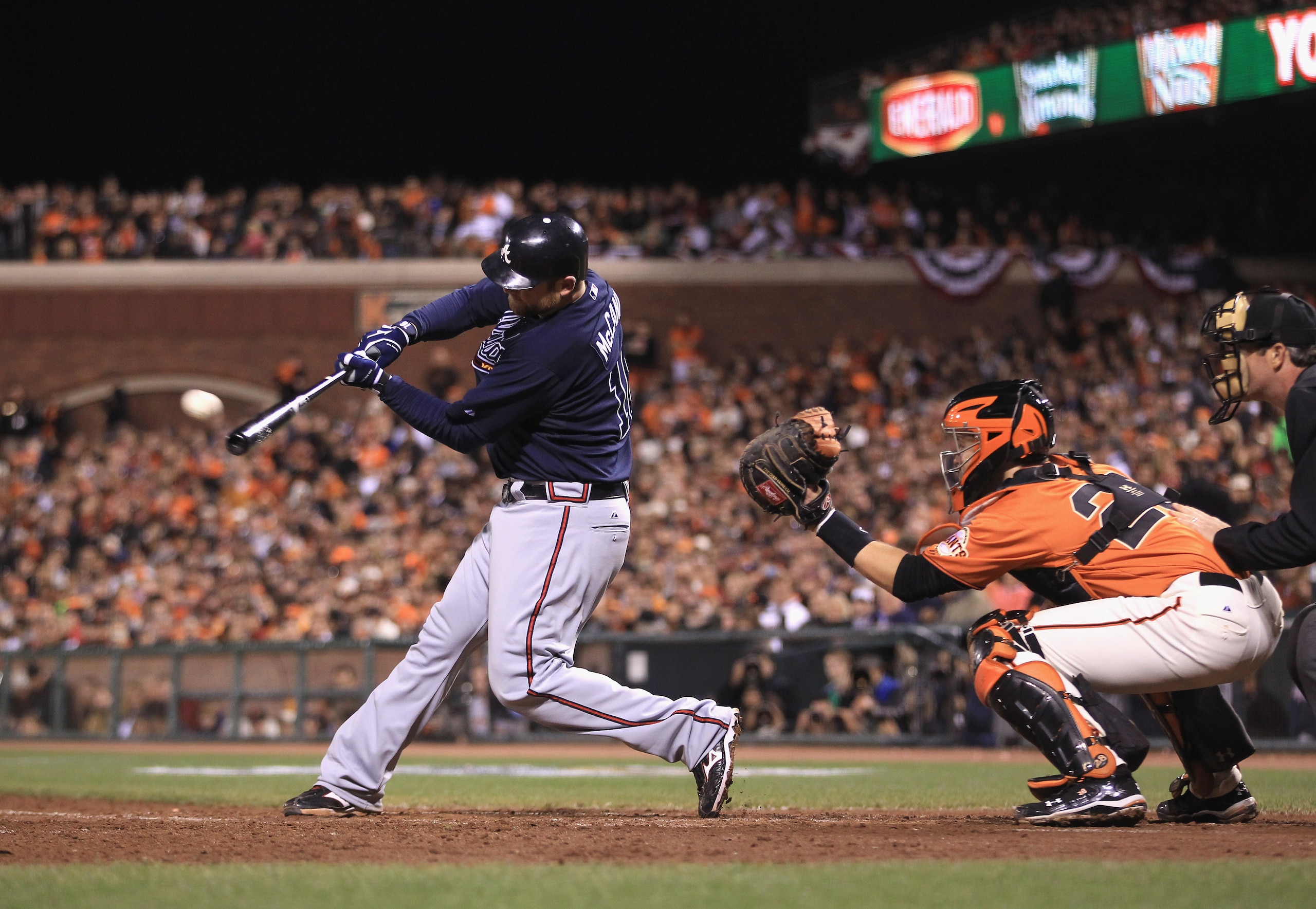 SAN FRANCISCO - OCTOBER 08:  Brian McCann #16 of the Atlanta Braves hits a single that scored Derrek Lee in the sixth inning of their game against the San Francisco Giants in game 2 of the NLDS at AT&T Park on October 8, 2010 in San Francisco, California.