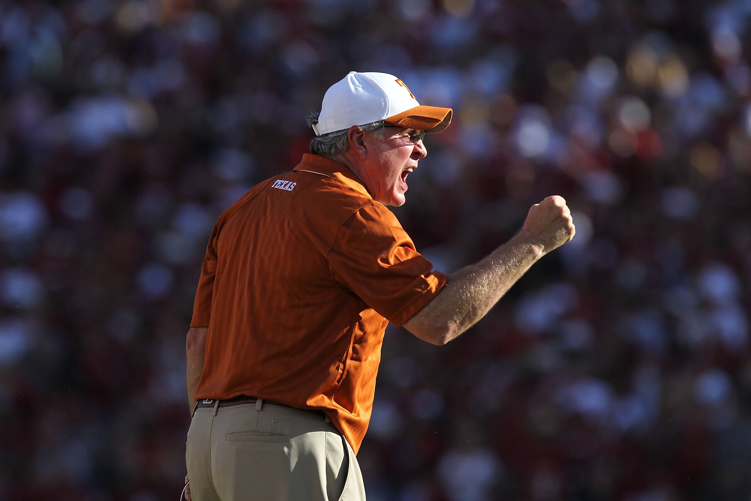 DALLAS - OCTOBER 02: Head coach Mack Brown of the Texas Longhorns yells on the sidelines during play against the Oklahoma Sooners at the Cotton Bowl on October 2, 2010 in Dallas, Texas. (Photo by Ronald Martinez/Getty Images) DALLAS - OCTOBER 02: Head coach Mack Brown of the Texas Longhorns yells on the sidelines during play against the Oklahoma Sooners at the Cotton Bowl on October 2, 2010 in Dallas, Texas. (Photo by Ronald Martinez/Getty Images)